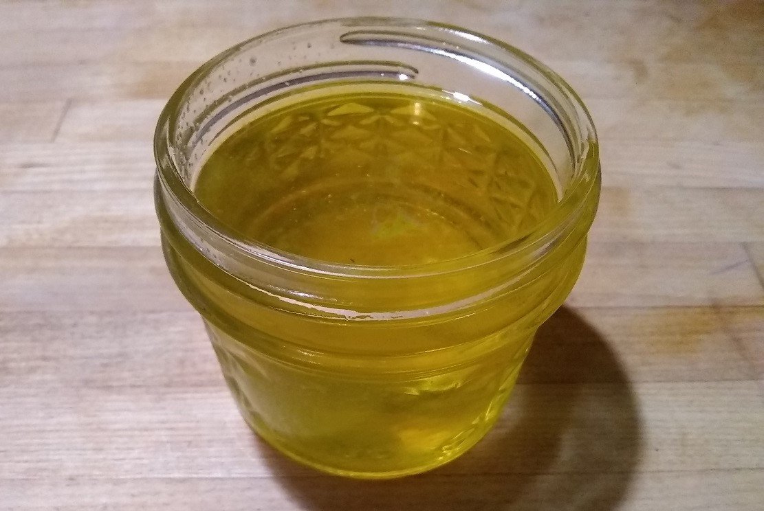Half pint jar full of hickory oil
