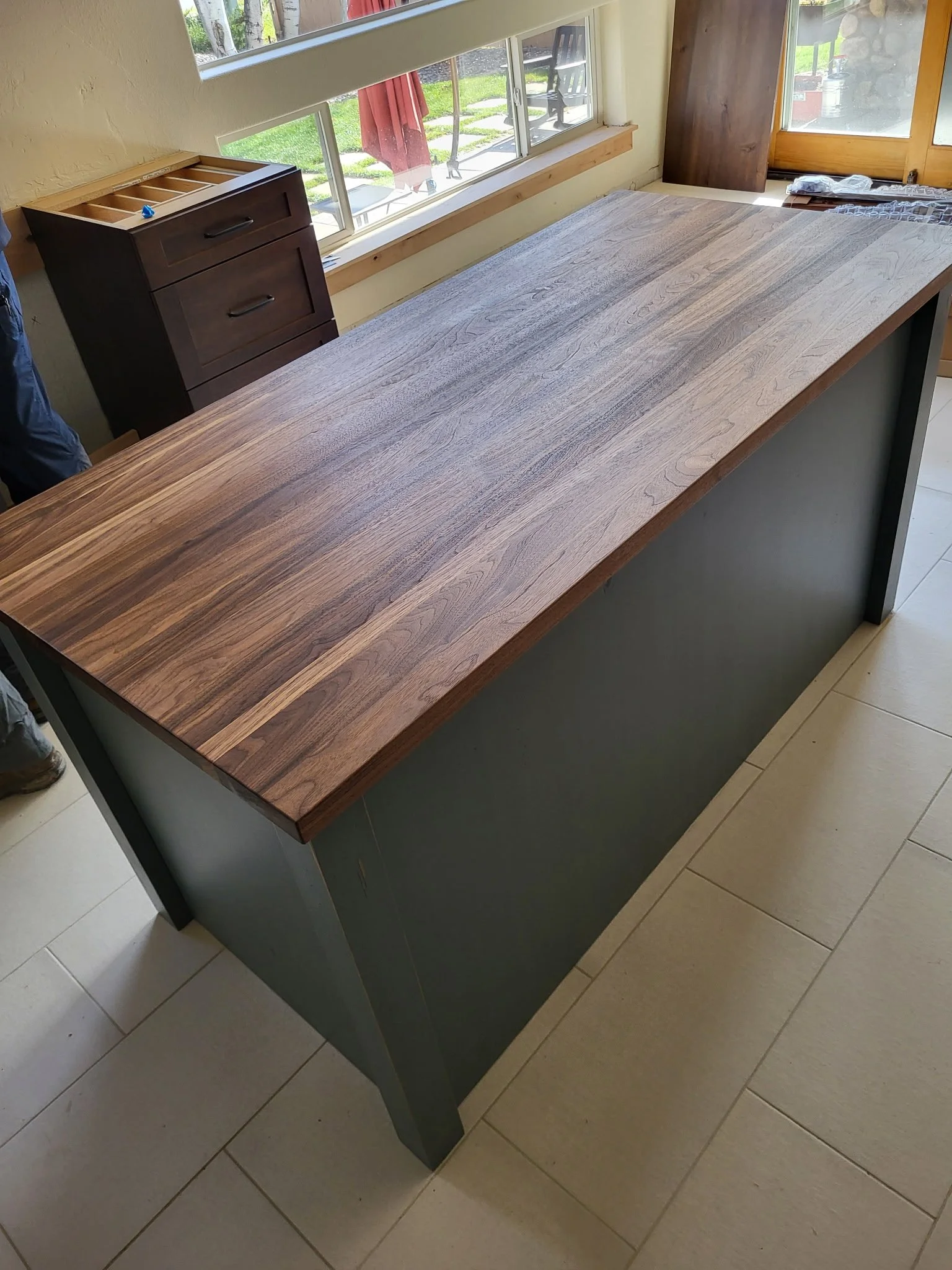Handcrafted walnut butcher block island top, seamless joinery and rich wood grain—functional and elegant custom kitchen feature by Animas Craft Woodworks.