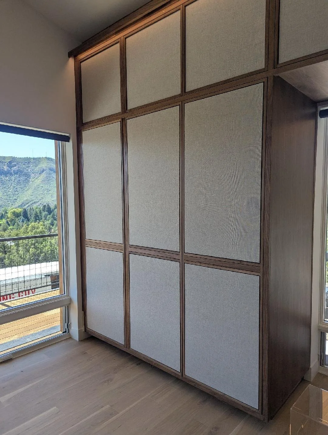 Our cabinetry capabilities are only limited by our and your imagination. These custom walnut cabinets have acoustic fabric panels to hide speakers and equipment.