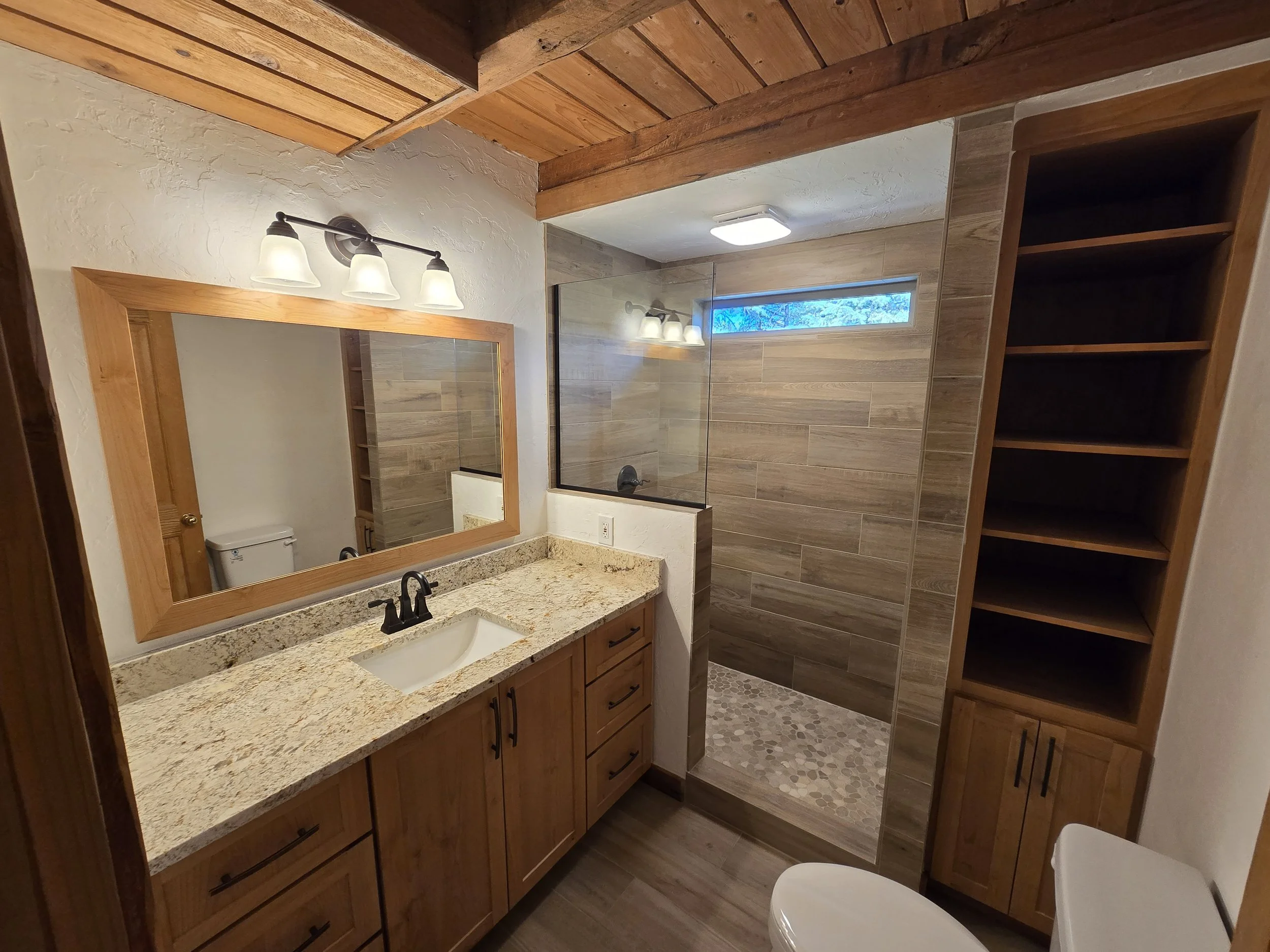 Custom Alder Bathroom Cabinetry and Mirror for a cabin in Vallecito, CO.