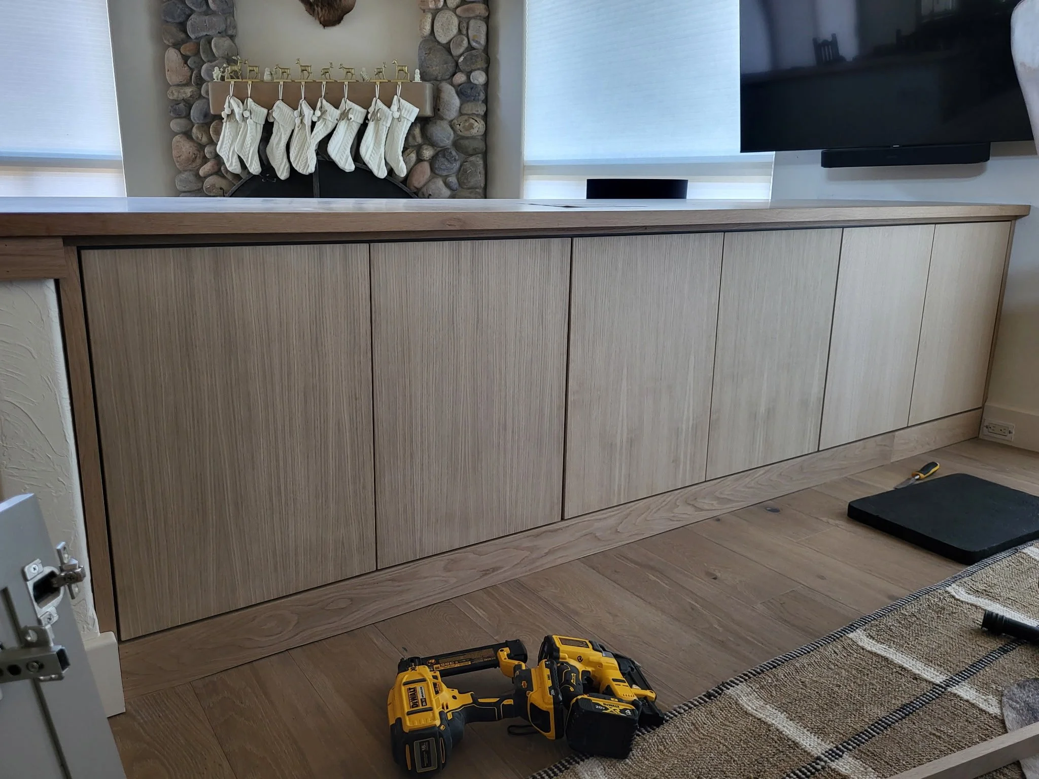 Kitchen transformation with new push-to-open, soft-close cabinet doors and drawer fronts in continuous green-stained white oak, paired with white oak countertops—modern, warm upgrade for a Southwest Colorado mountain home.
