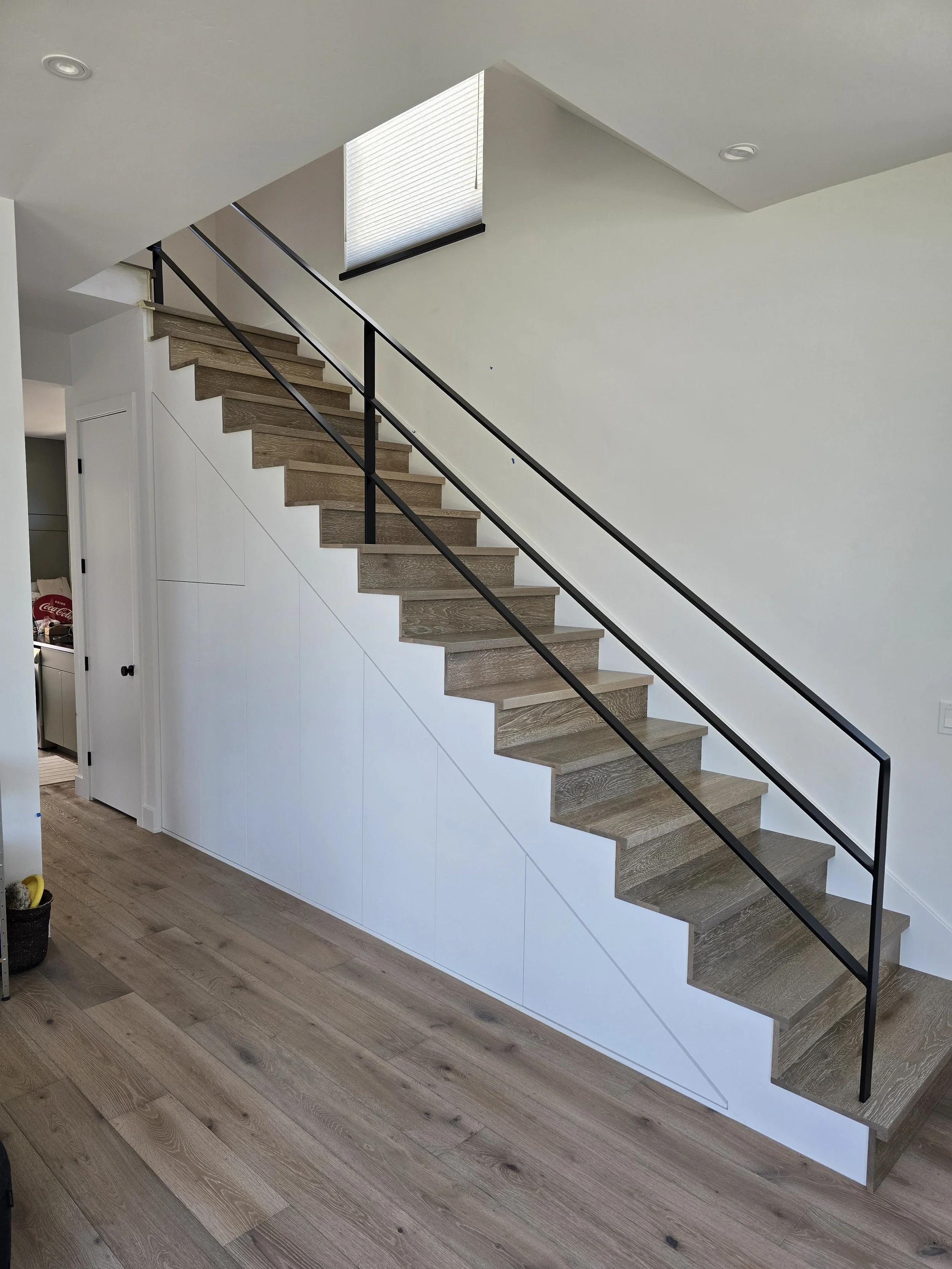 Hidden Storage Cabinets Beneath Staircase