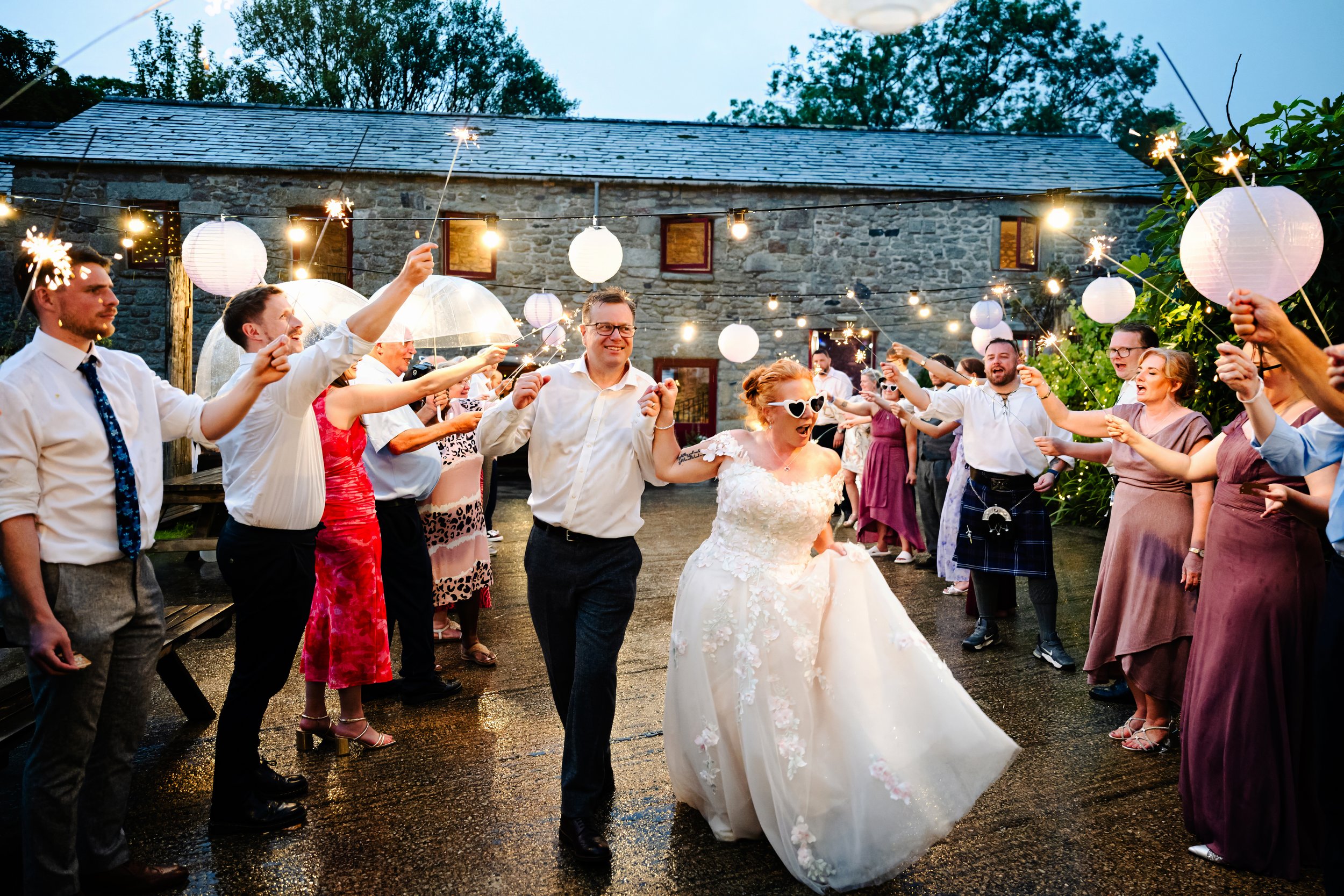 Candid wedding photography in Cornwall, Southwest UK. Funny Candid wedding moments captured by Cornwall wedding photographer, Devon Wedding Photographer. Knightor Winery Wedding Photographer. Sparklers Wedding Photos.