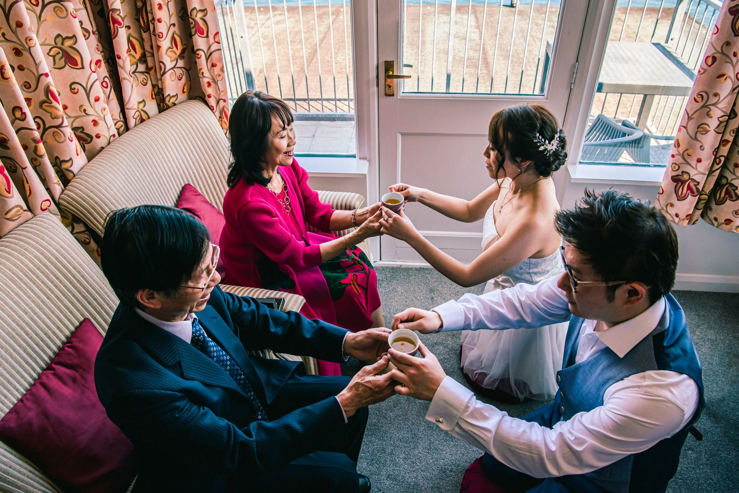 Candid wedding photography in Devon, Southwest UK. Candid wedding moments captured by Devon wedding photographer, Cornwall Wedding Photographer. Asian Wedding. Chinese Tea Ceremony Wedding. Chinese Wedding.