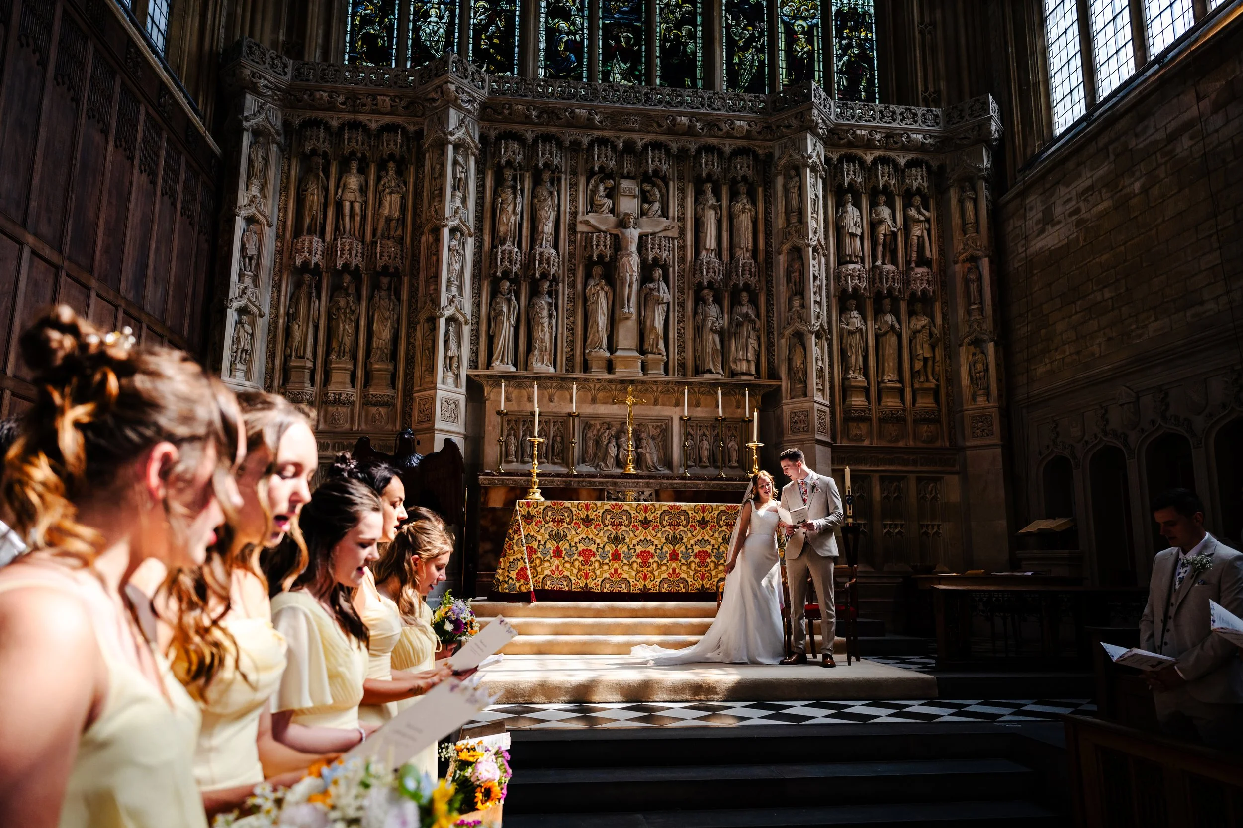Candid wedding photography in the Cotswolds, Southwest UK. Candid wedding moments captured by Cornwall wedding photographer, Devon Wedding Photographer, Cotswolds Wedding Photographer, Cheltenham Wedding Photographer. Cheltenham University Wedding.