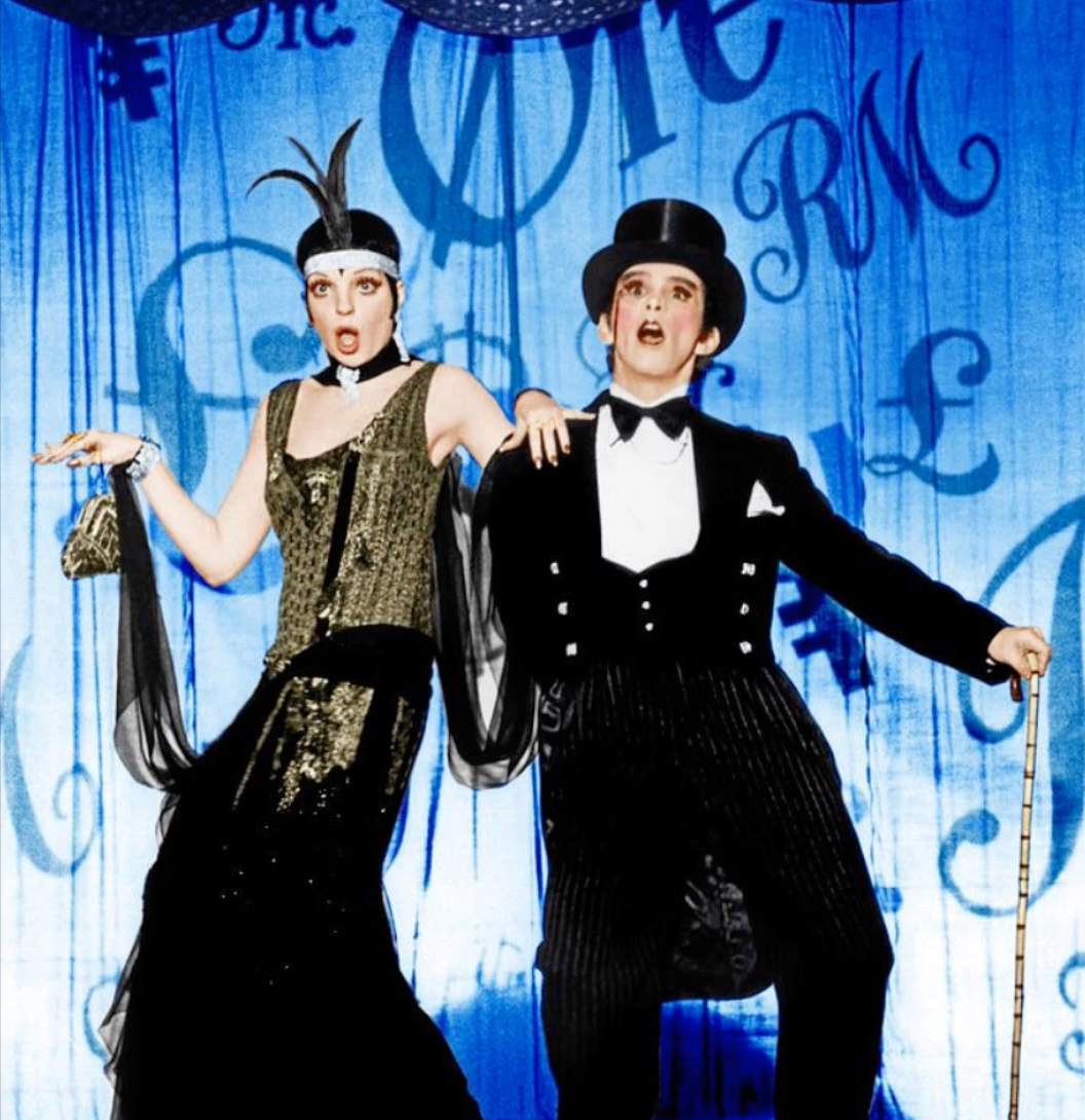 Call her now. Ooh, page her, or page her and have her call my cell phone and we can sing the money song from Cabaret. You be Liza, I’ll be Joel.”