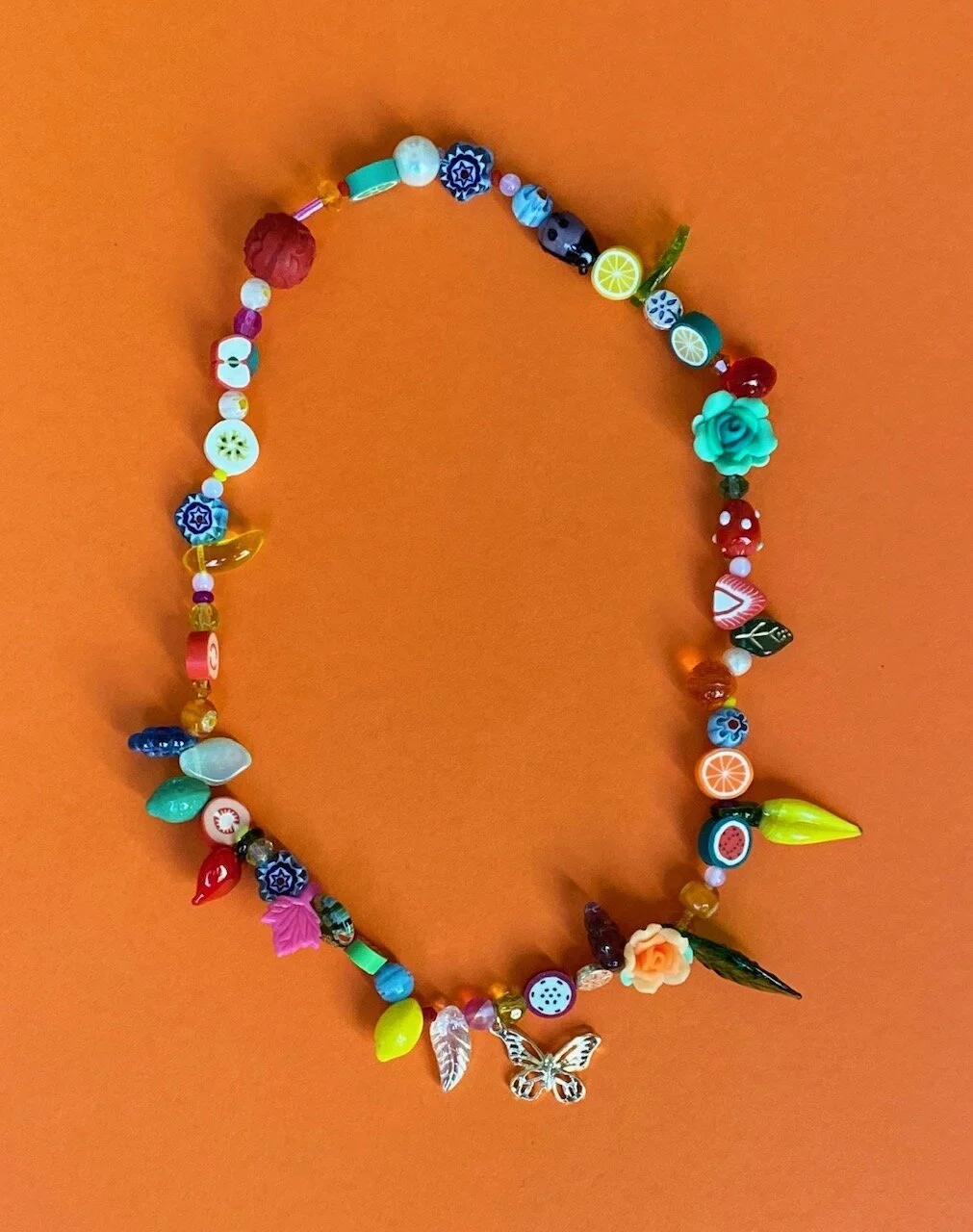 Fruit and Flower Necklace with a 14k Gold Plate Butterfly Charm