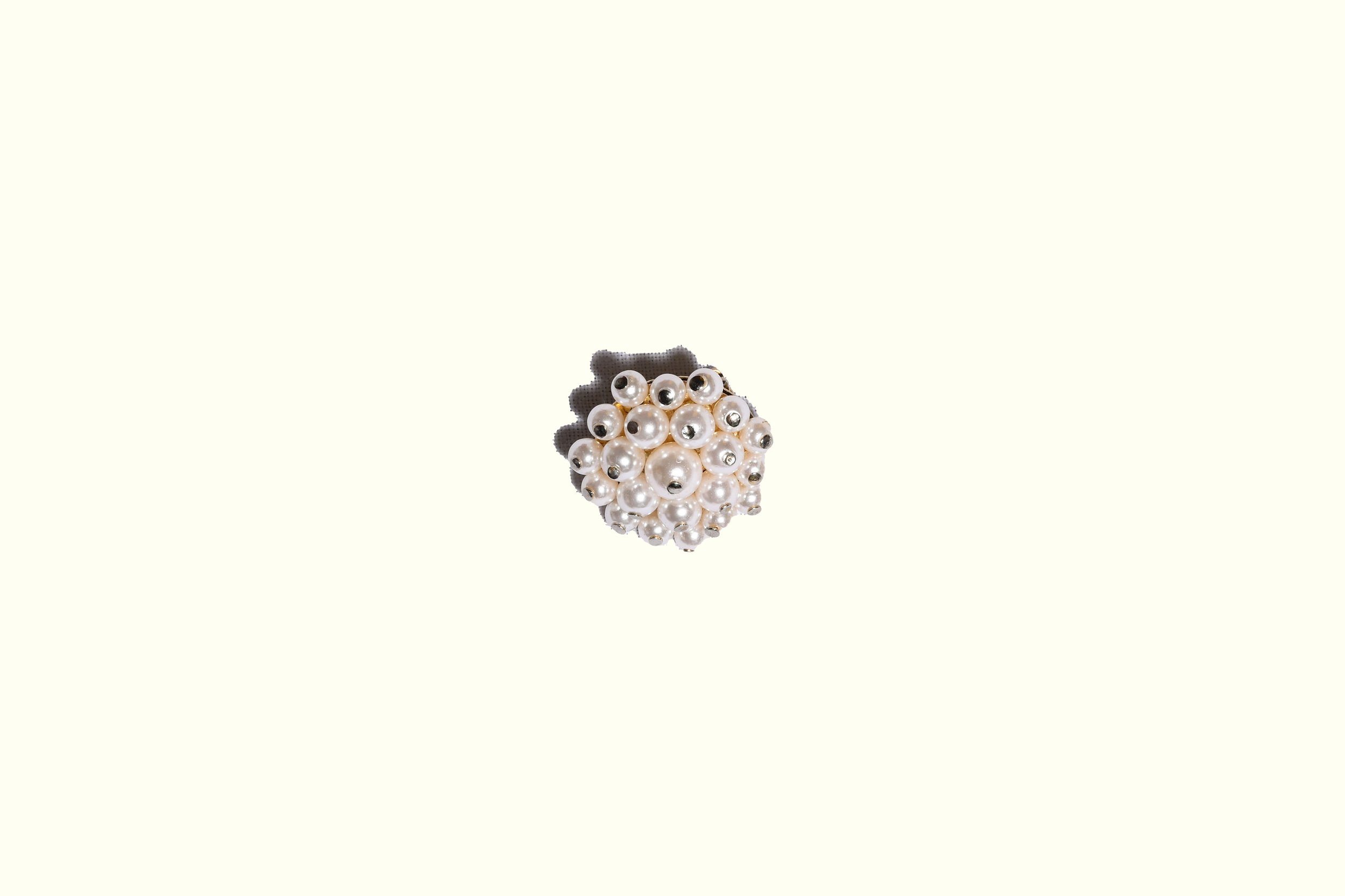 Vintage pearly burst brooch.jpg
