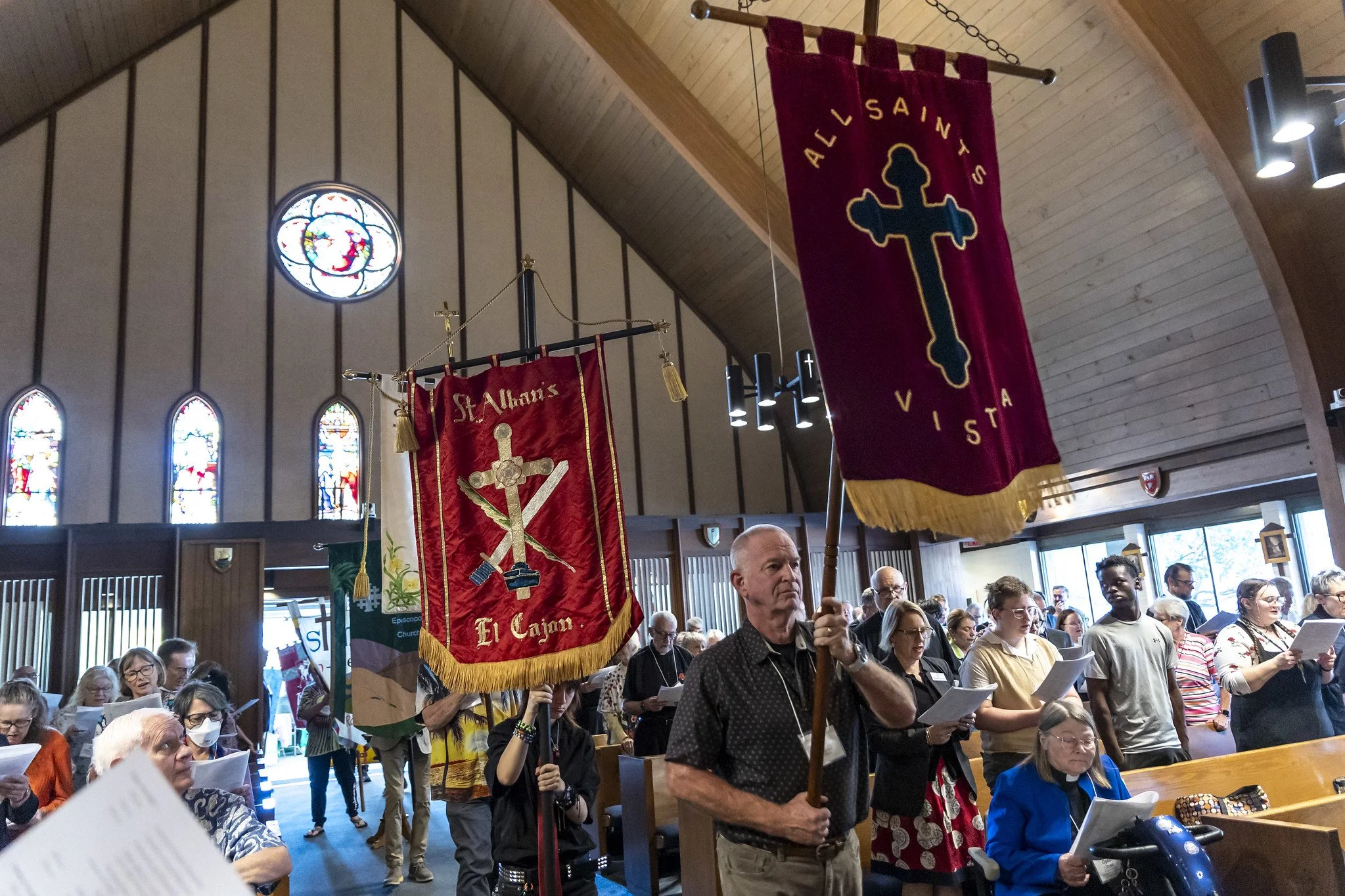 The banner for All Saints Episcopal Church being carried by parishioner Paul McCarthy at the Episcopal Diocese of San Diego Convention.