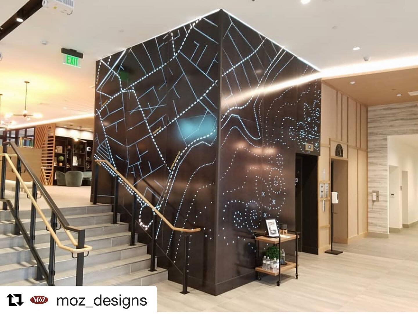 Located in the @livecladwell apartments in Lynn, Massachusetts, @moz_designs Classic Ebony metal sheets were custom-designed and illuminated to ground the contemporary lobby space. 

Cut Outs and Backlighting by @signartboston 
Construction by @proco