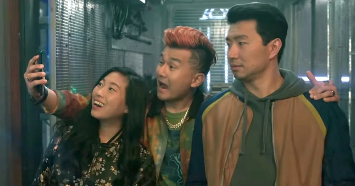 Shang-Chi and the Legend of the Ten Rings owes its comic relief to performers such as Awkwafina as Katy Chen (left) and Ronny Chieng as Jon Jon (middle). (Courtesy of The Walt Disney Company)