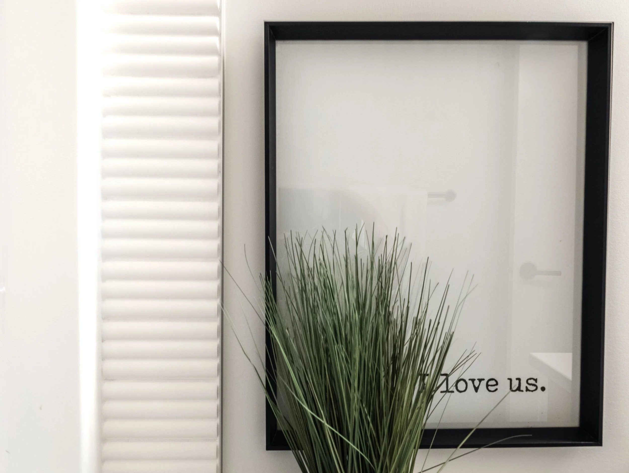 Close-up of a luxury bathtub featuring a vertical fluted tile surround, a subtle textural detail that reflects the home’s artisanal design.