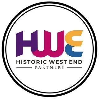 Logo for Historic West End Partners featuring the initials HWE in purple, pink, and orange colors, with the text "HISTORIC WEST END PARTNERS" underneath.