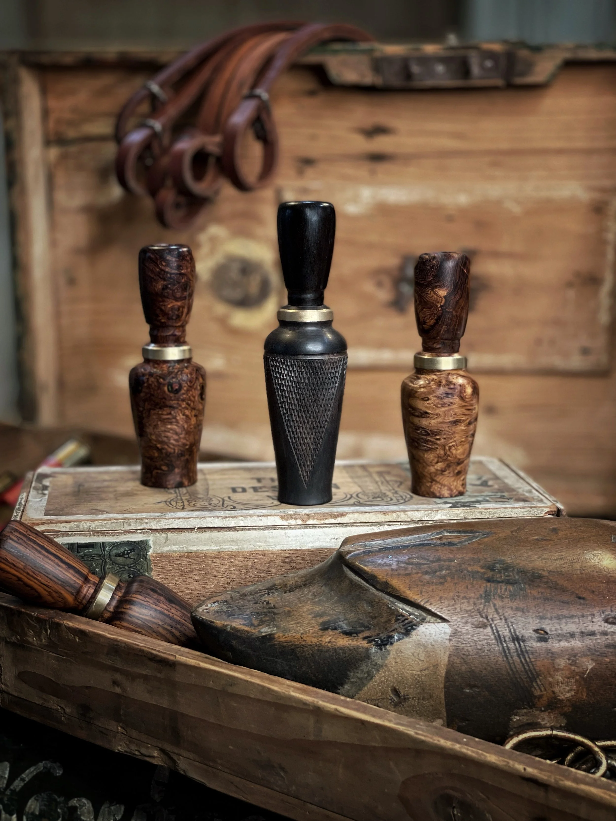 Hand Turned and checkered duck calls. 