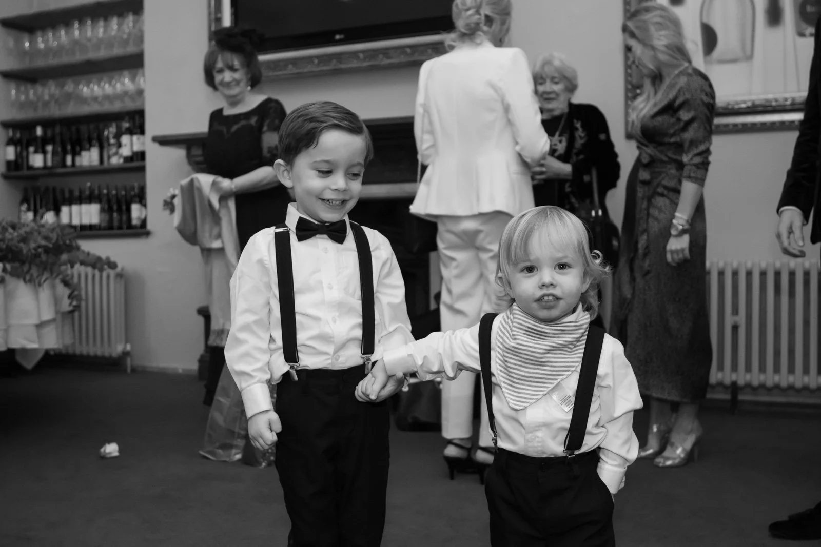 sons of the married couple stand hand in hand after wedding in Cardiff