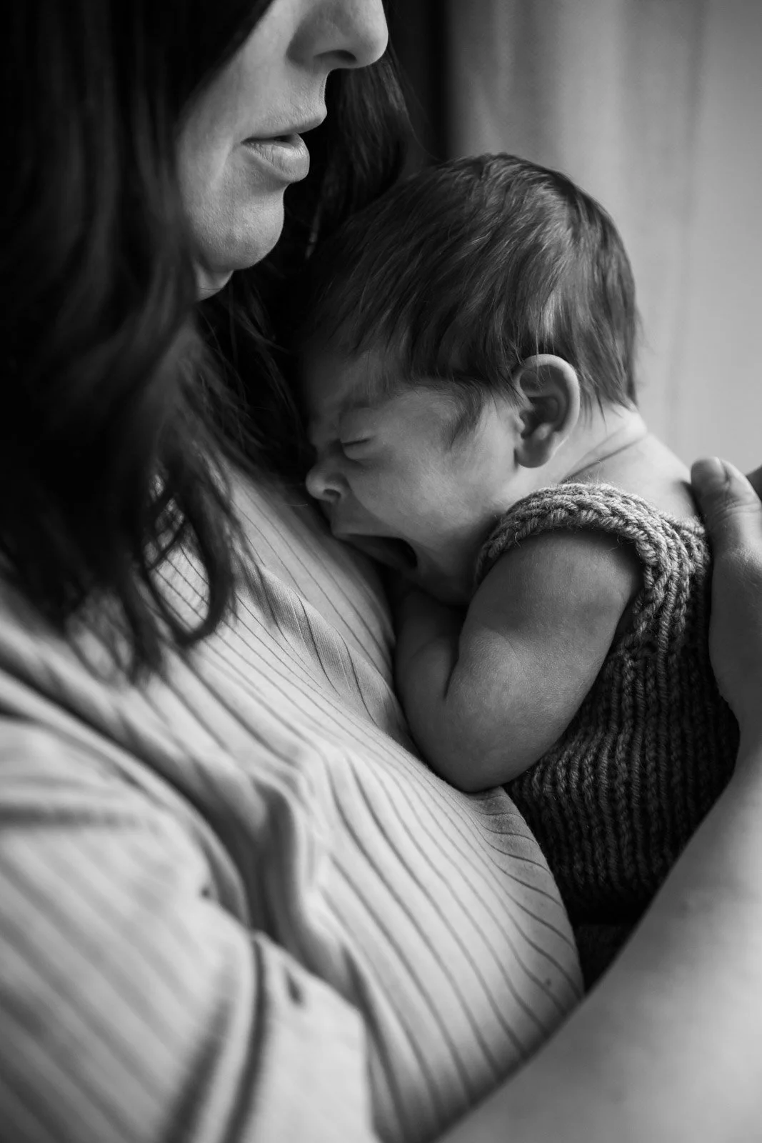 baby boy held my mother yawns