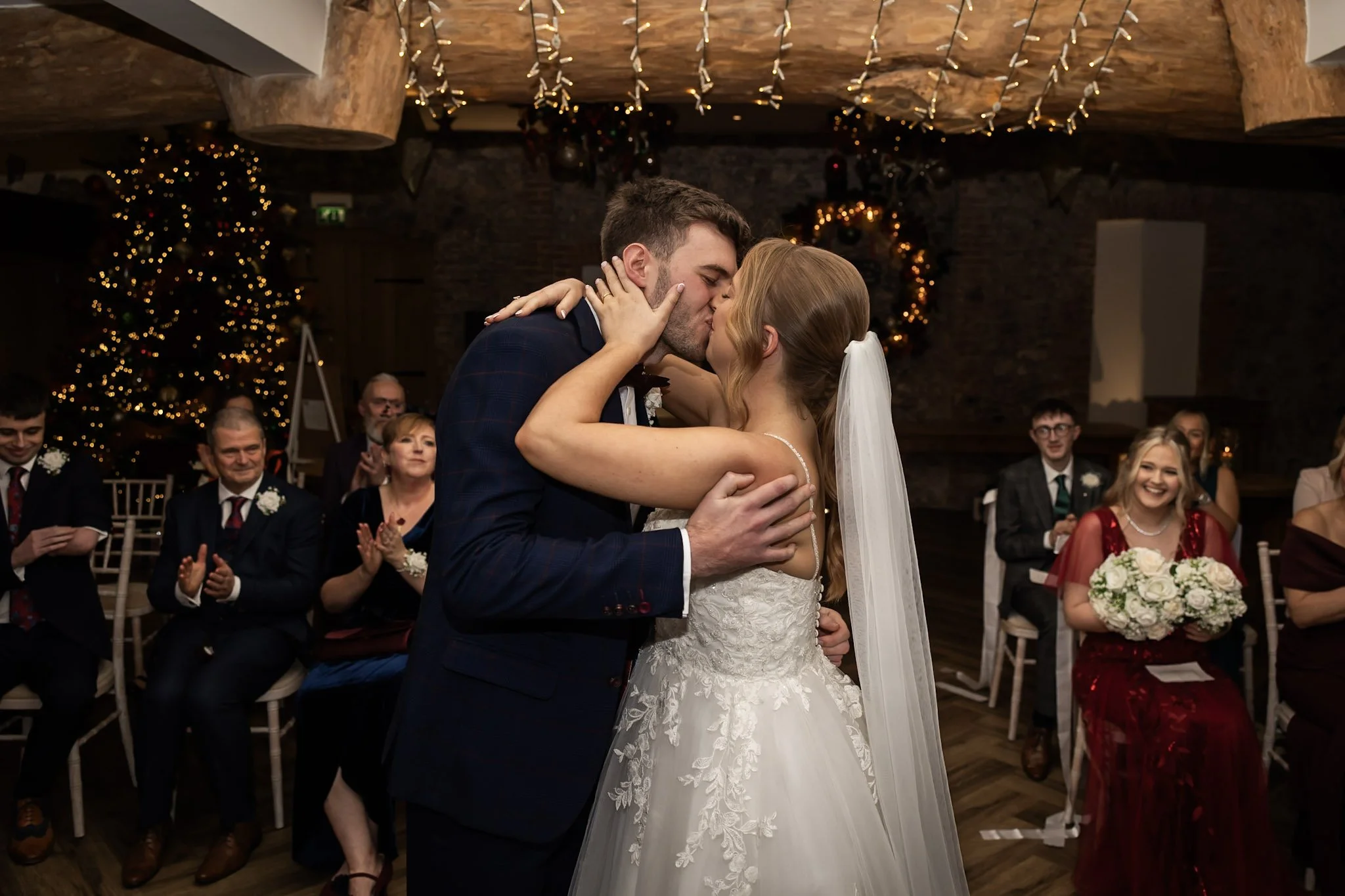 bride and groom kiss swansea bay hotel
