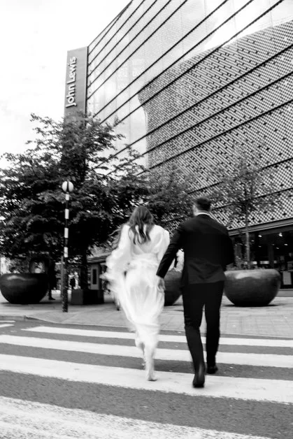 Cardiff wedding bride and groom walk through city