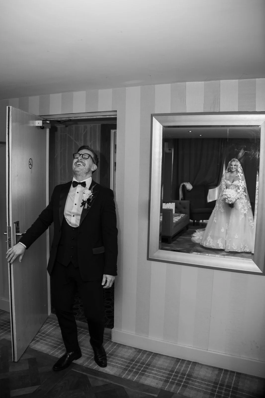 brother of the bride has a first look at his sister in wedding dress