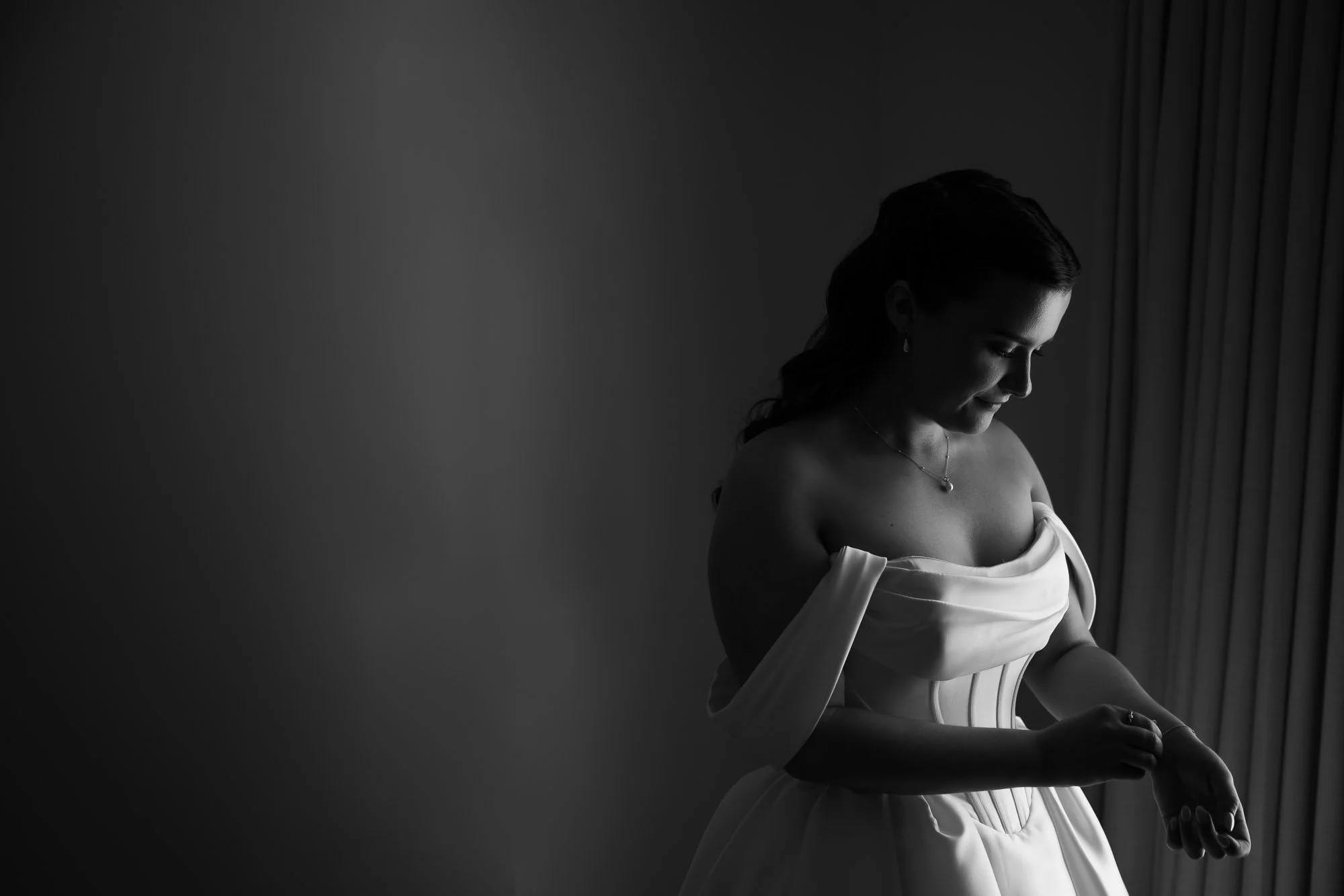bride adjusting jewellery