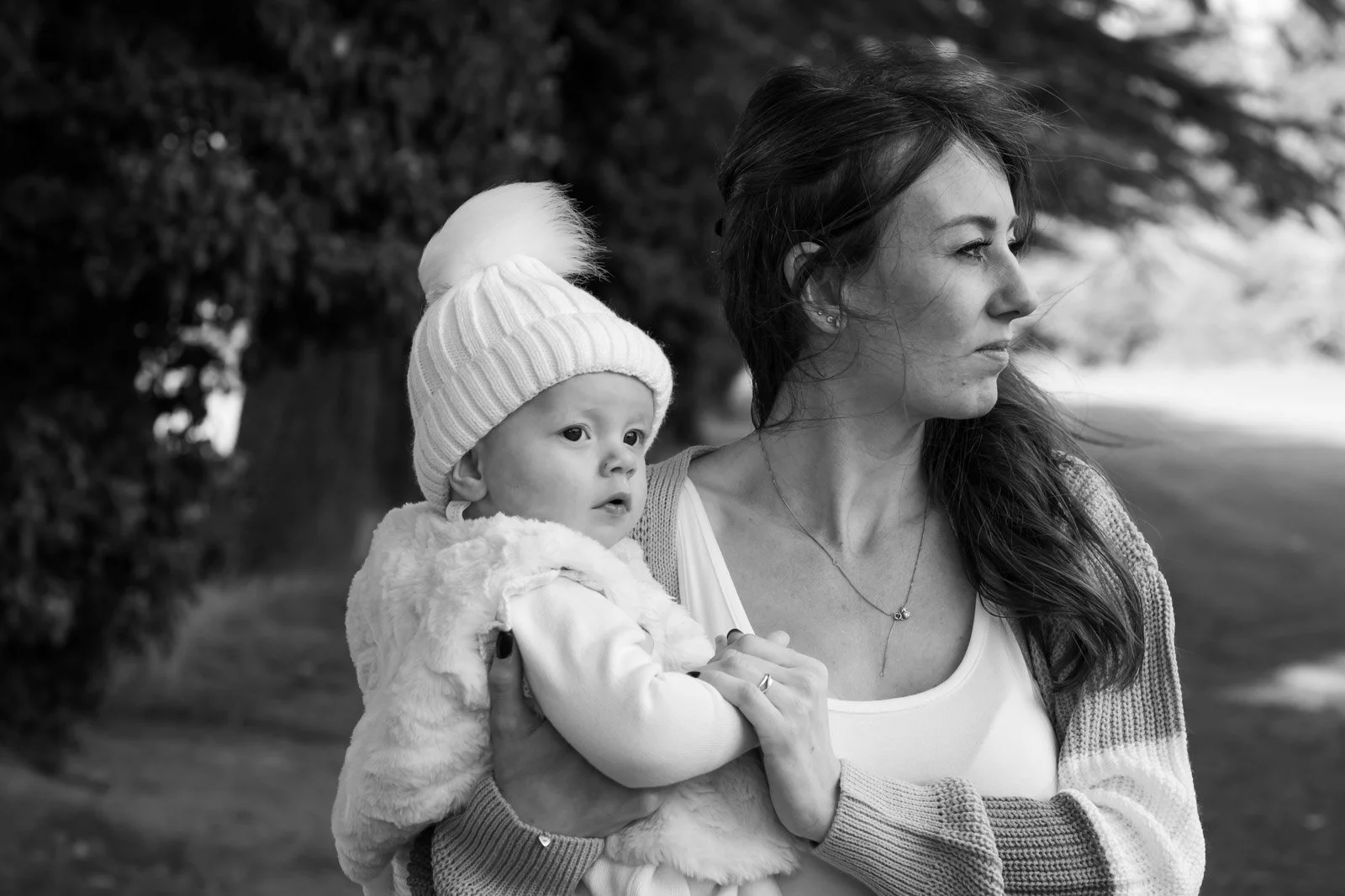 mum and toddler daughter look into distance on path at Tredegar House