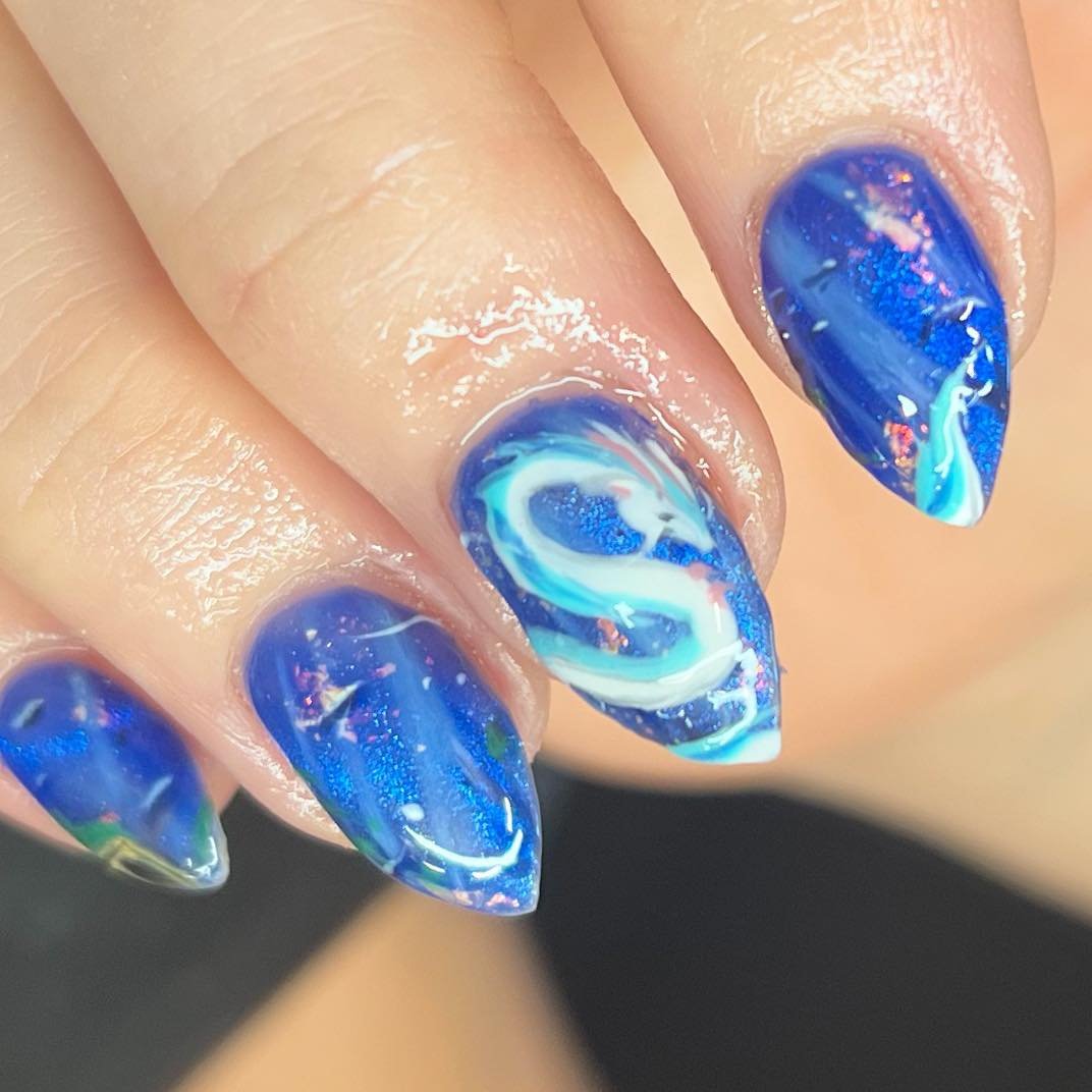 Dive into the depths of creativity!
Hand-painted underwater dragons are just the beginning. 
Our artists fearlessly tackles every challenge to bring your wildest nail dreams to life! 💅 #nailart