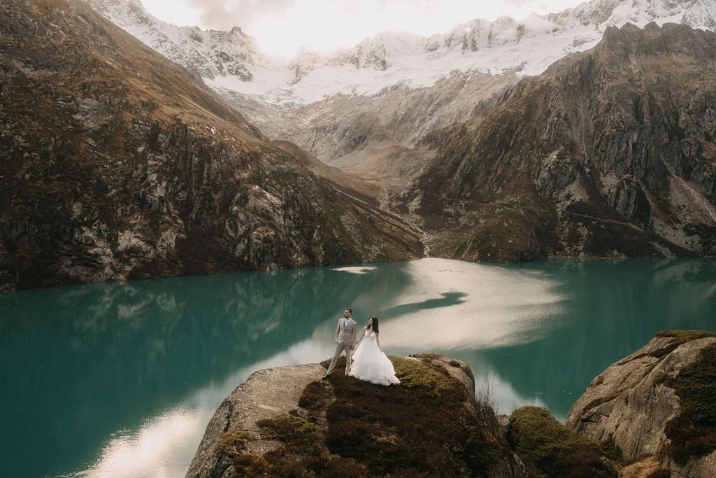 Elopement portrait of bride and groom in alpine landscape in Switzerland