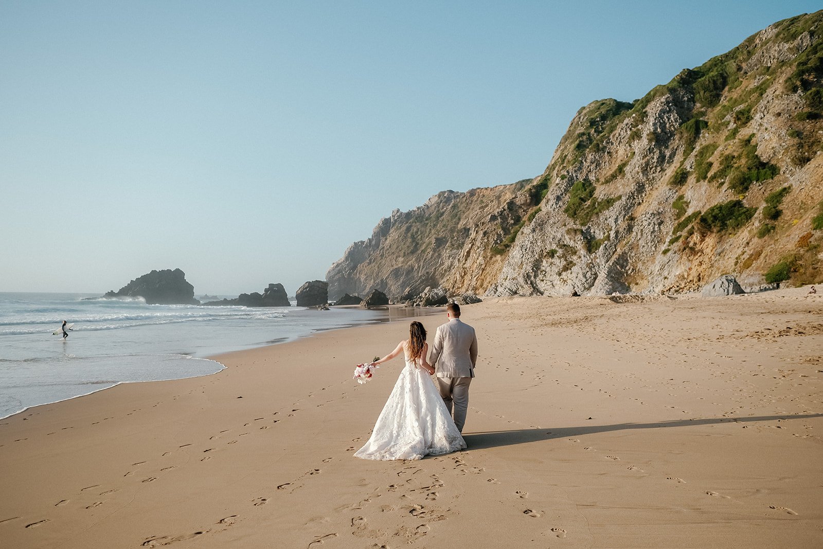 Elopement wedding portrait of bride and groom beach in portugal