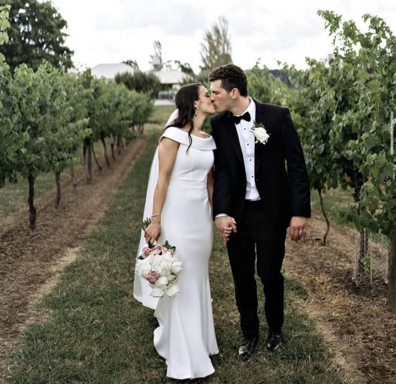 Yarra Valley, couple holding hands and kissing with beautiful scenery