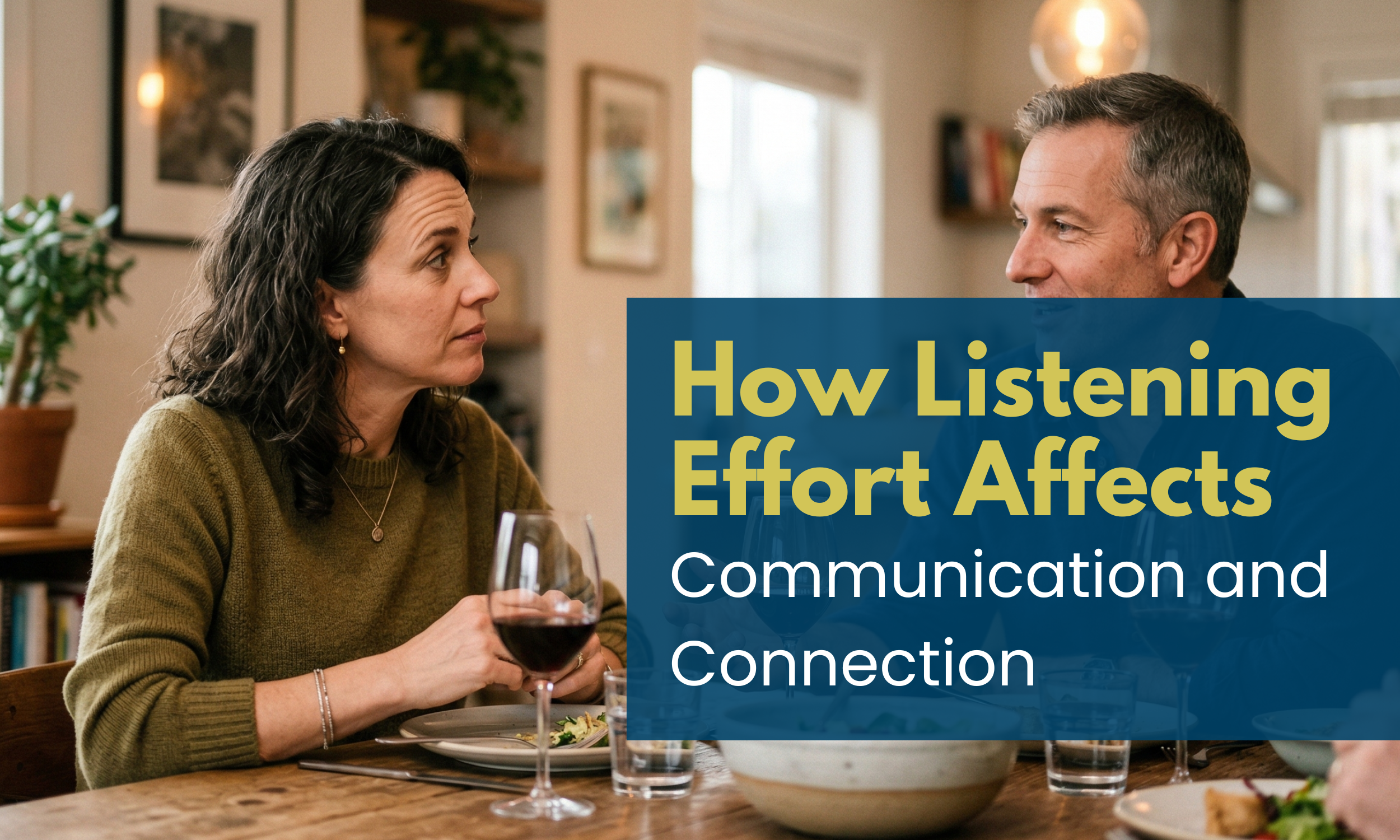Two people in conversation at a dinner table, representing connection and listening effort in everyday life.