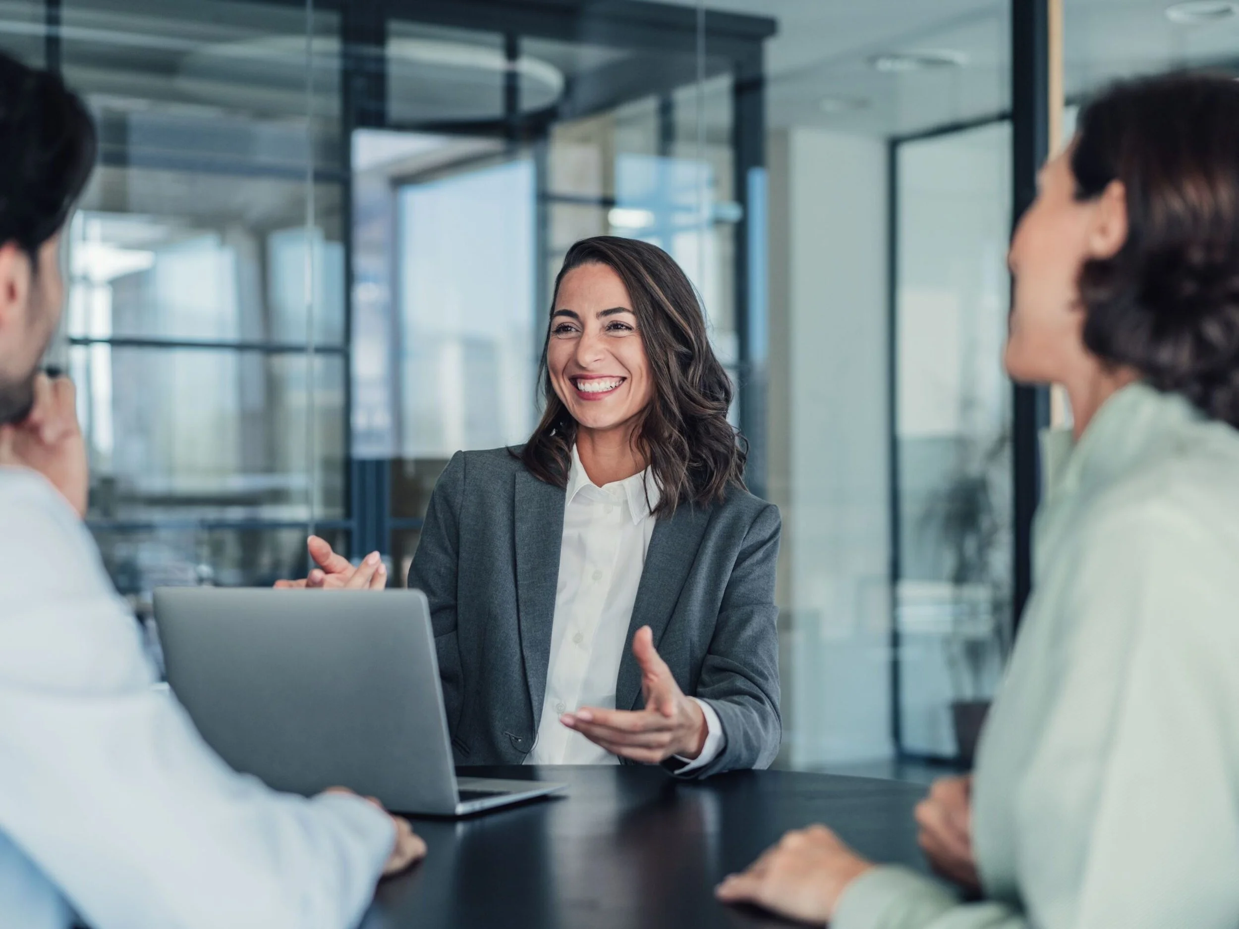 Certum Solutions advisor helping a business owner review financial and operational dashboards