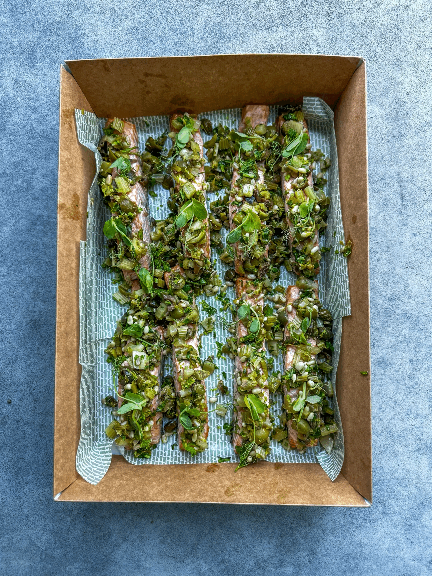 Roast salmon with pine nut, caper & raisin salsa