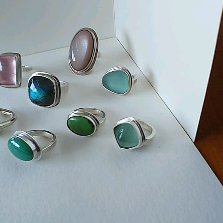 In progress now, RINGS!  Little bit of an impromptu photo shoot from the bench, on this fine Saturday. 

Rose quartz, labradorite, turquoise, aquamarine, lapis, moonstone and English sea glass.  These should hit the shop Monday, most of these are siz