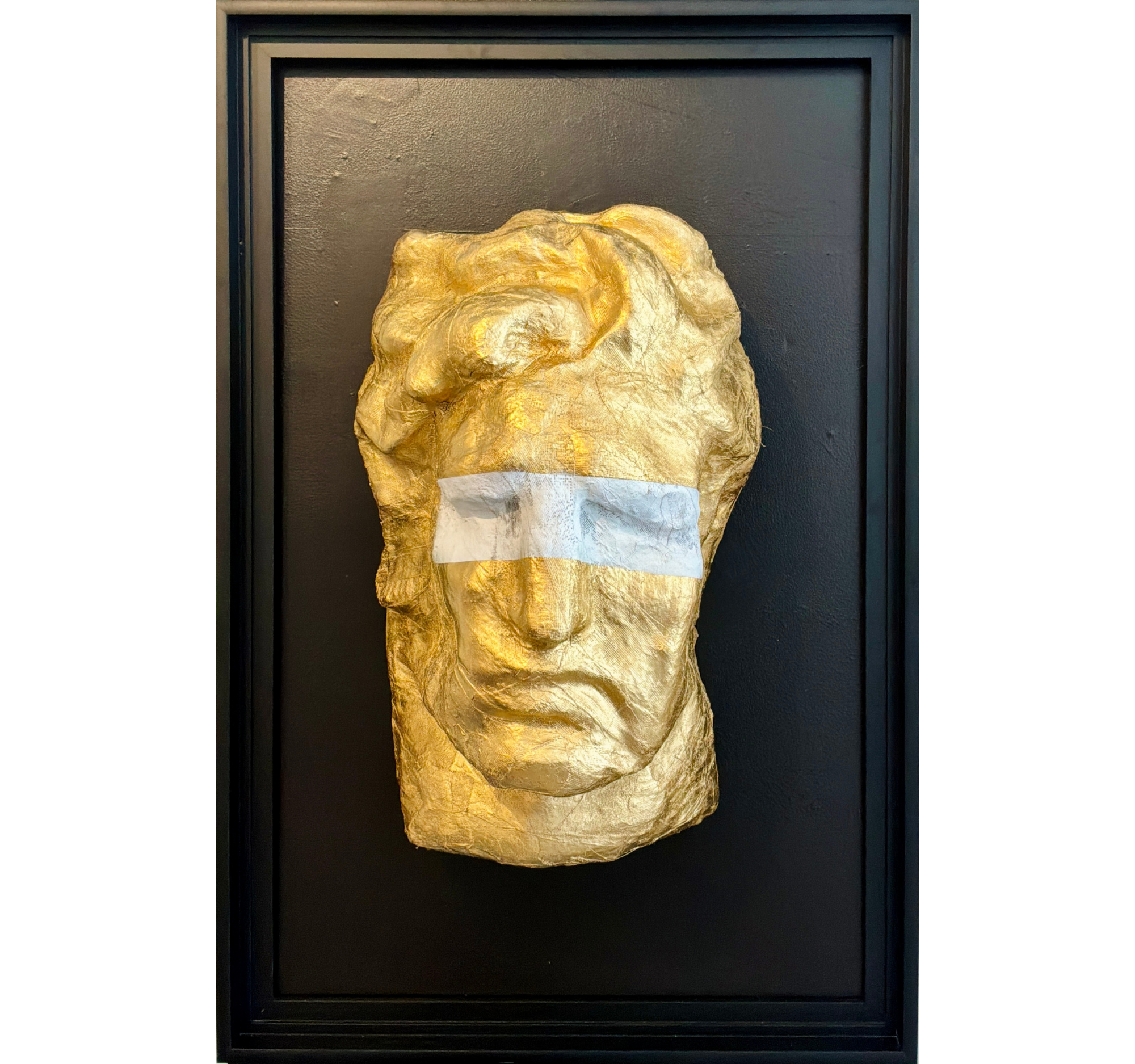 64. “Big Head in Gold with White Blindfold” Tony Mose | W24" x H36" x D18“; Frame: 36.5” x 55” | Head Only: $3600; Head with Frame: $4900