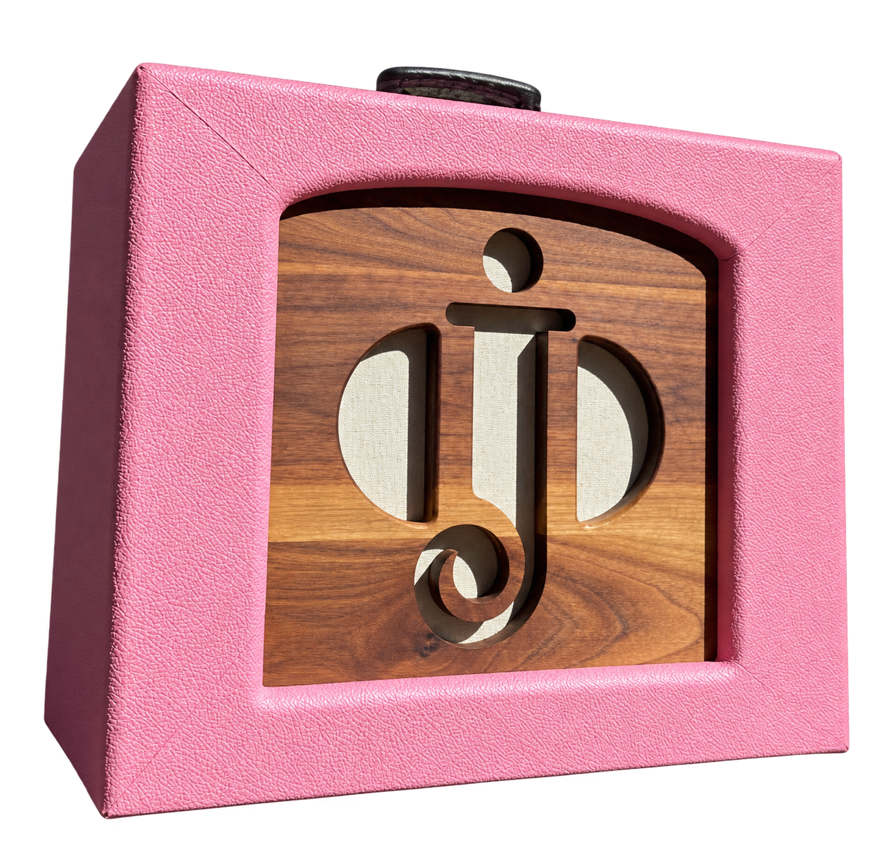 Pink custom combo amplifier with a walnut front panel featuring the jazz club’s cutout logo over cream grille cloth.