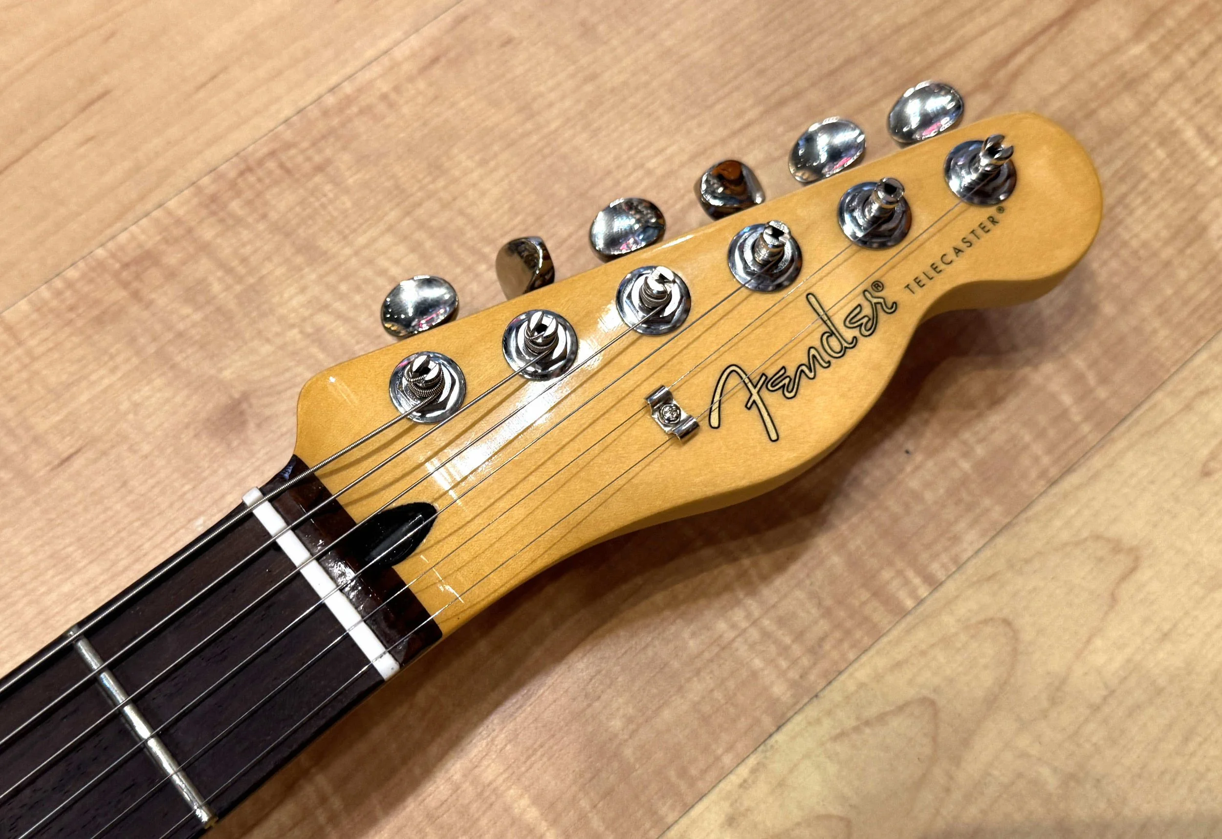 Headstock of the Fender Player II Telecaster HH Electric Guitar In Rallye Orange