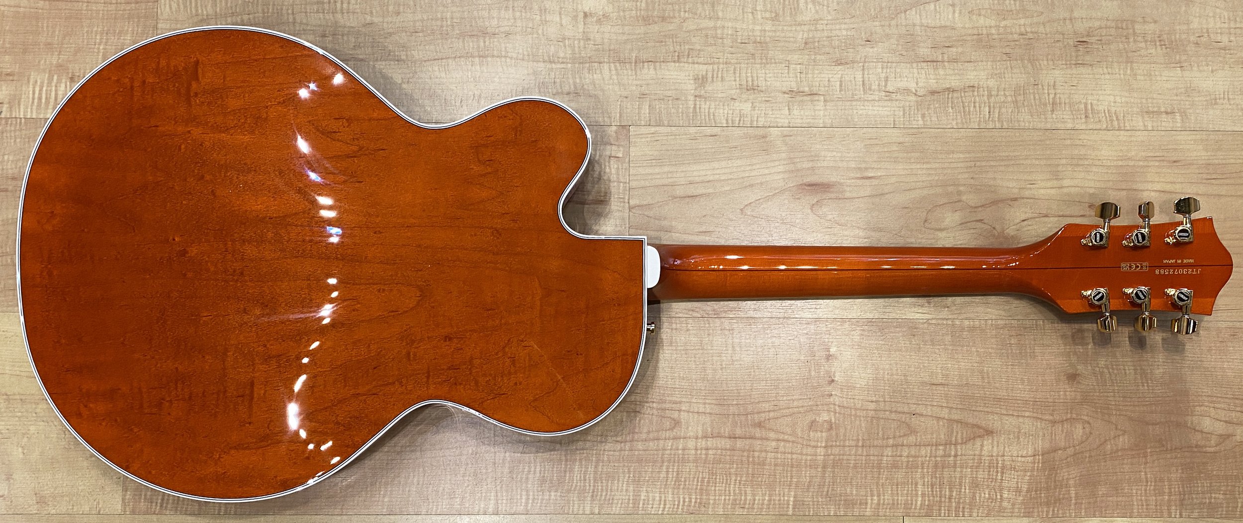 Back of the Gretsch G6120TG Players Edition Nashville Hollow Body with String-Thru Bigsby Electric Guitar in Orange Stain