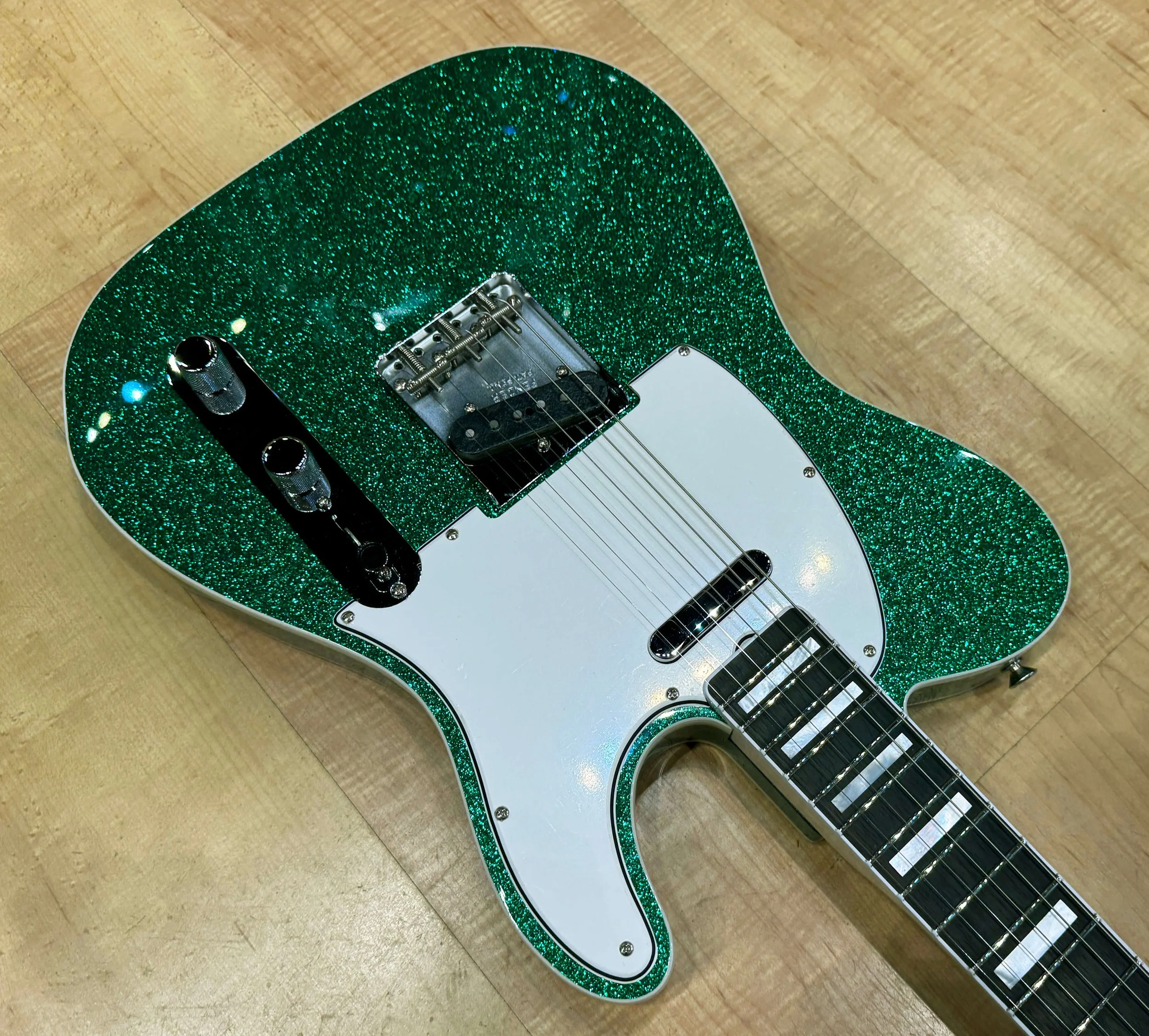 Pickguard of The Fender Custom Shop 60’s Telecaster Custom Electric Guitar In Green Sparkle