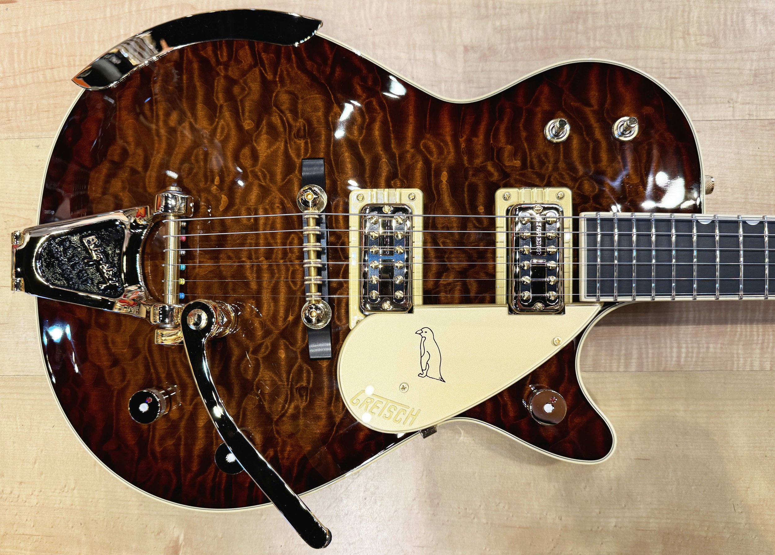 Body of the Gretsch G6134TGQM-59 Limited Edition Quilt Classic Penguin with Bigsby In Forge Glow Sunburst