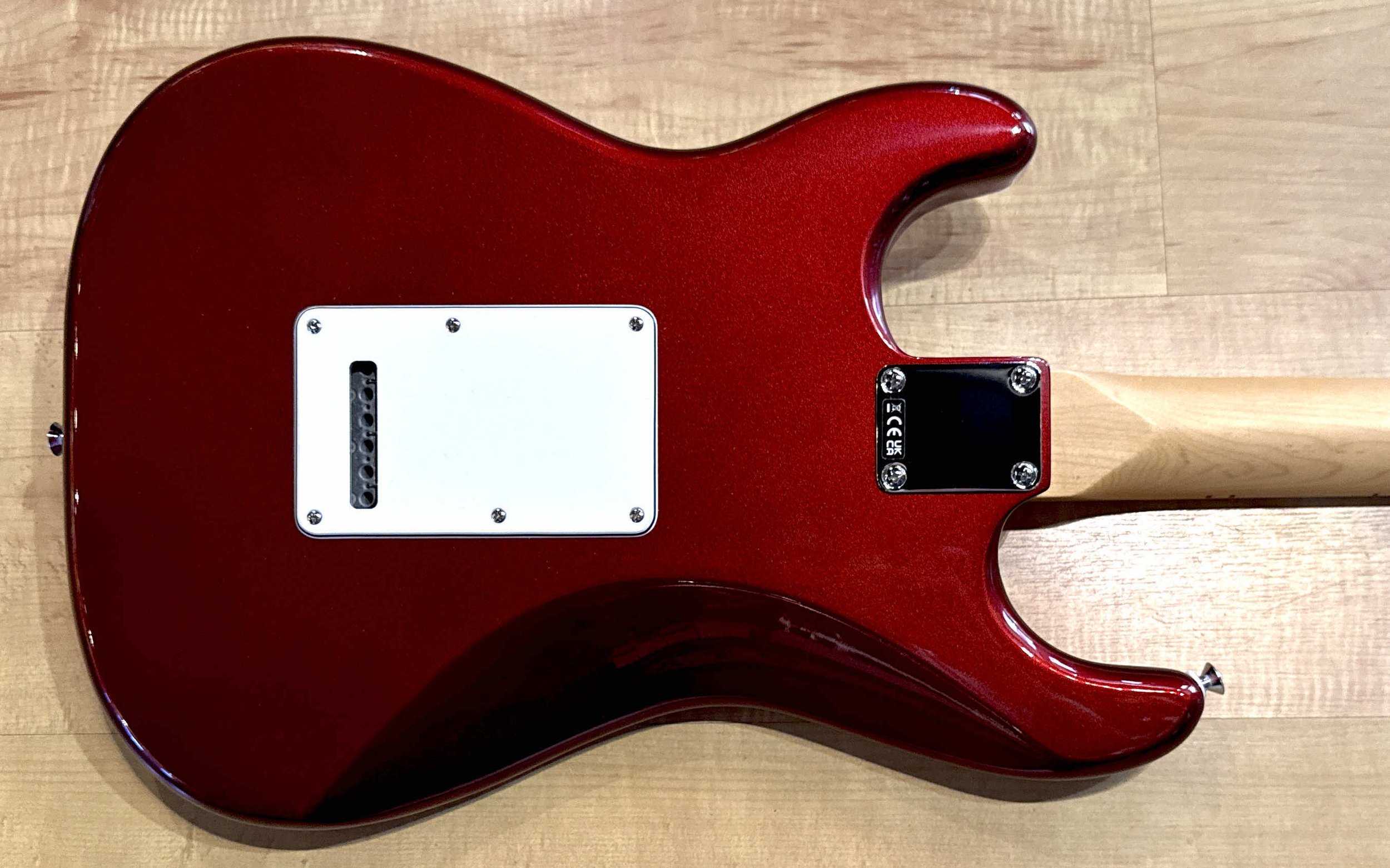 Back of the body of the Fender Standard Stratocaster Electric Guitar In Candy Cola