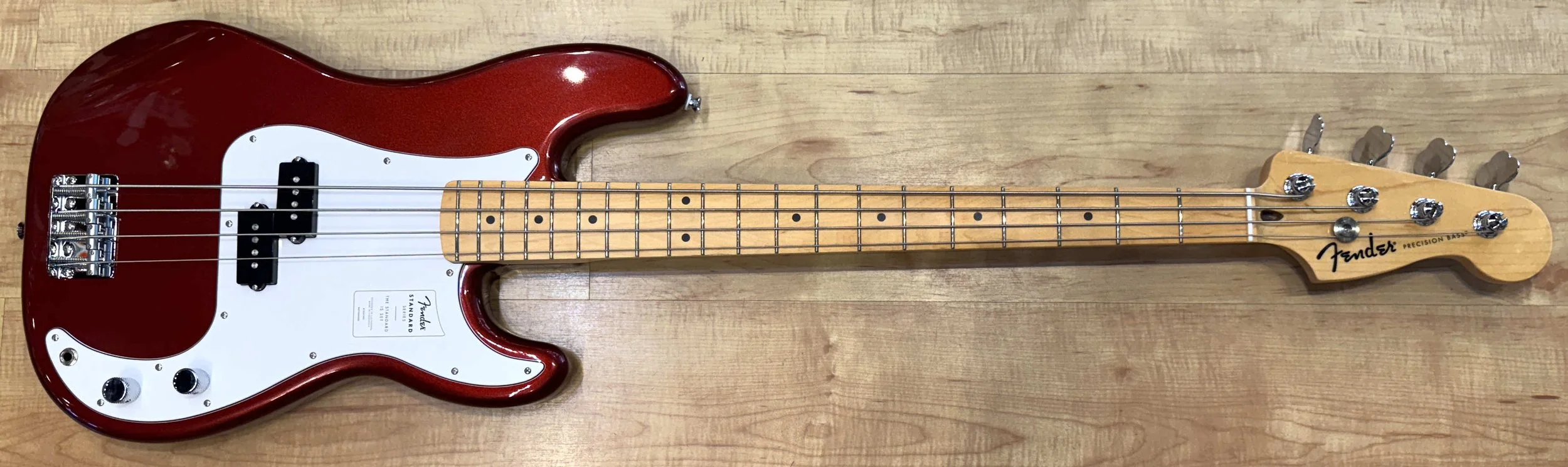 Front of the Fender Standard Precision Bass In Candy Apple Red