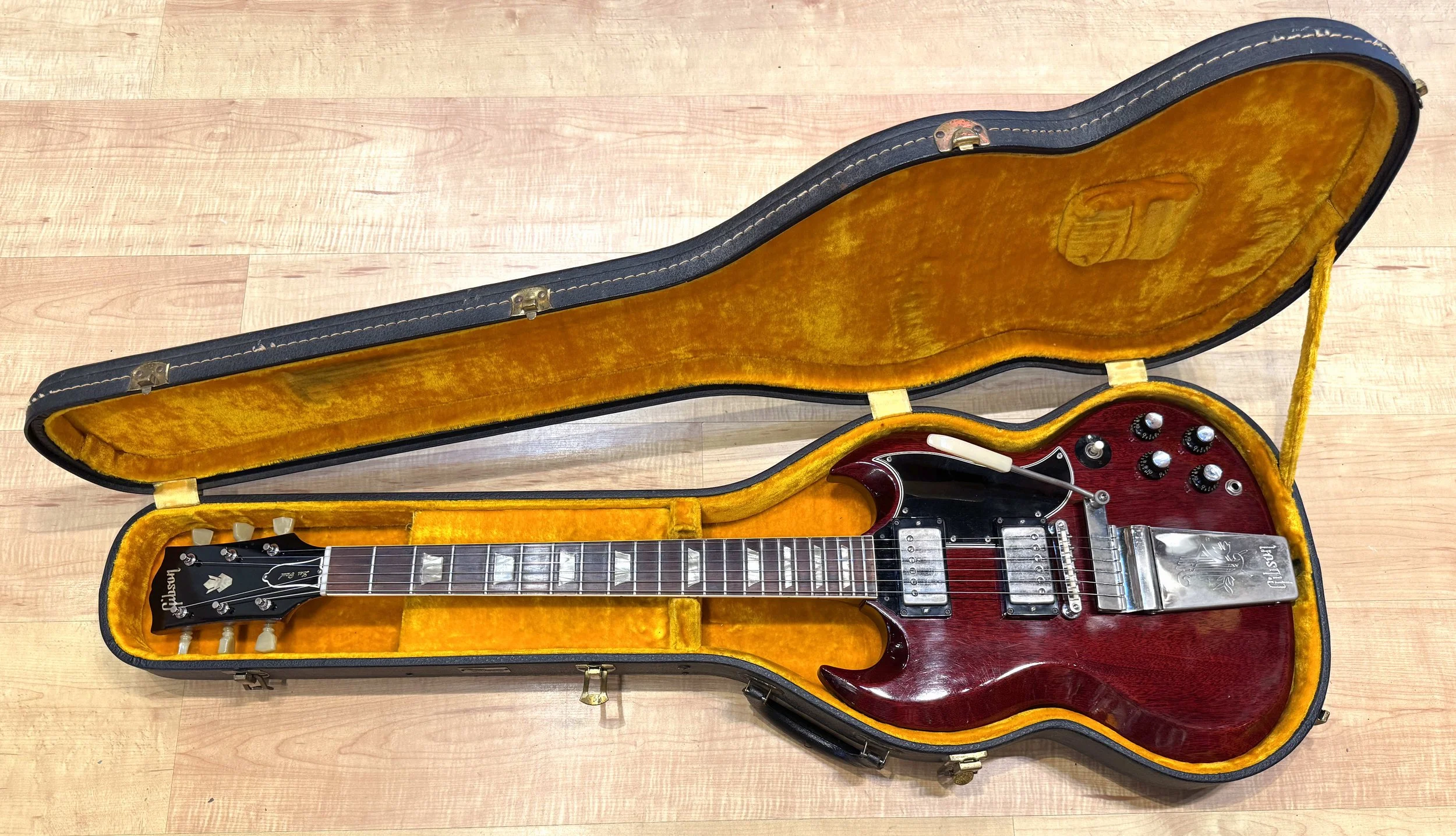 Guitar in the case of the Gibson Les Paul/SG Standard Model Solid Body Electric Guitar