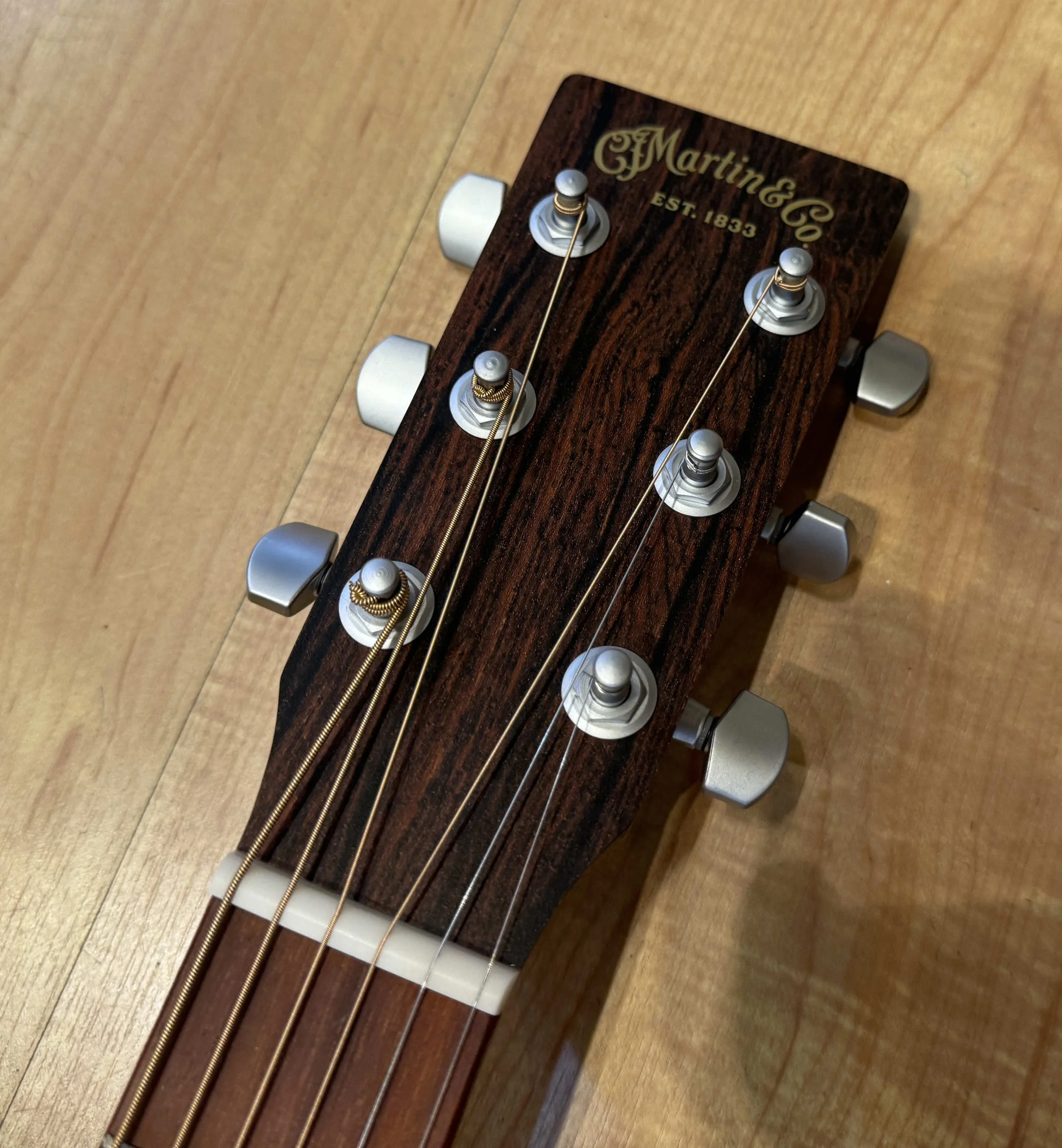 Headstock of the Martin X Series 00-X2E Cocobolo Acoustic Electric Guitar