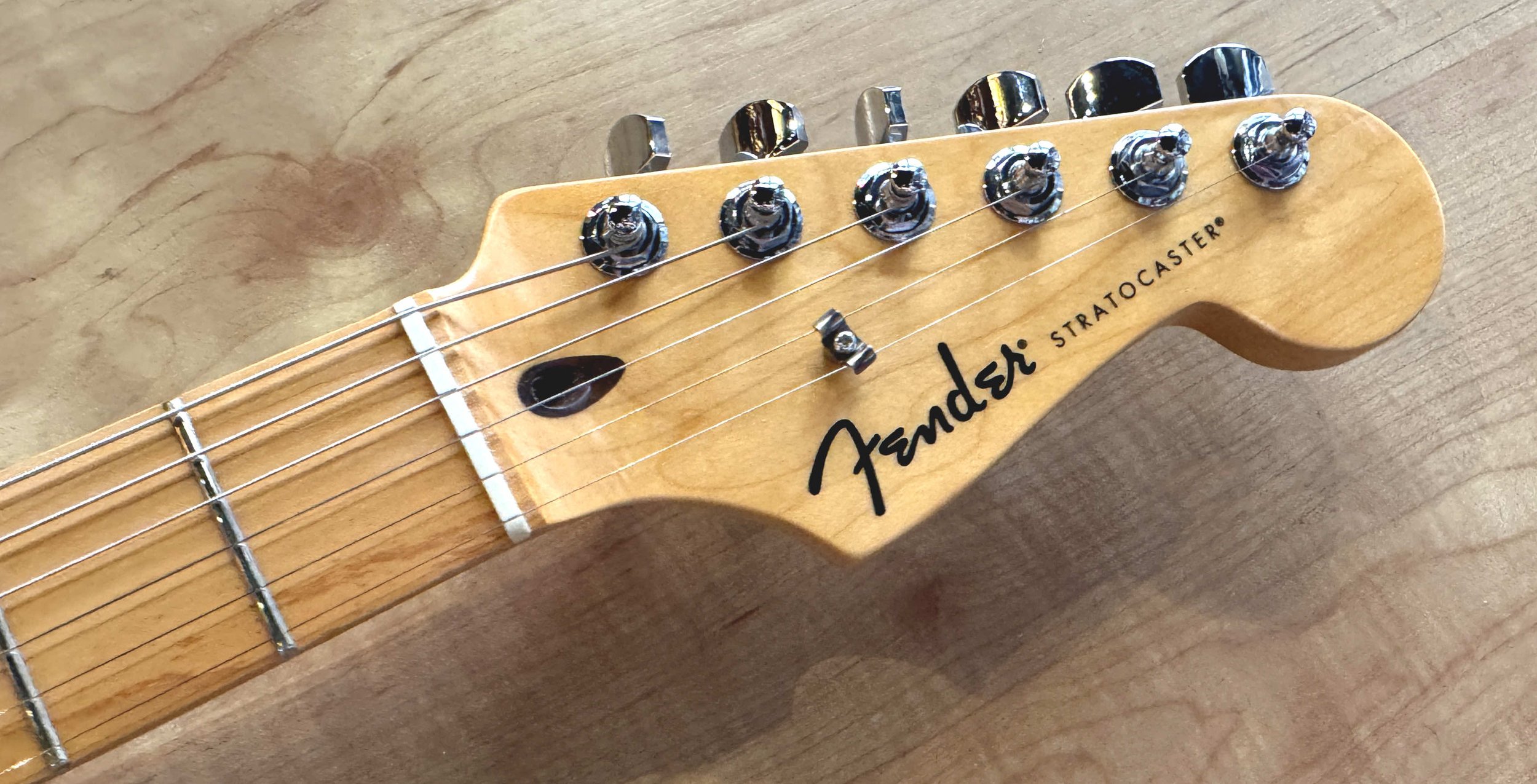 Headstock of the Fender Standard Stratocaster Electric Guitar In Olympic White