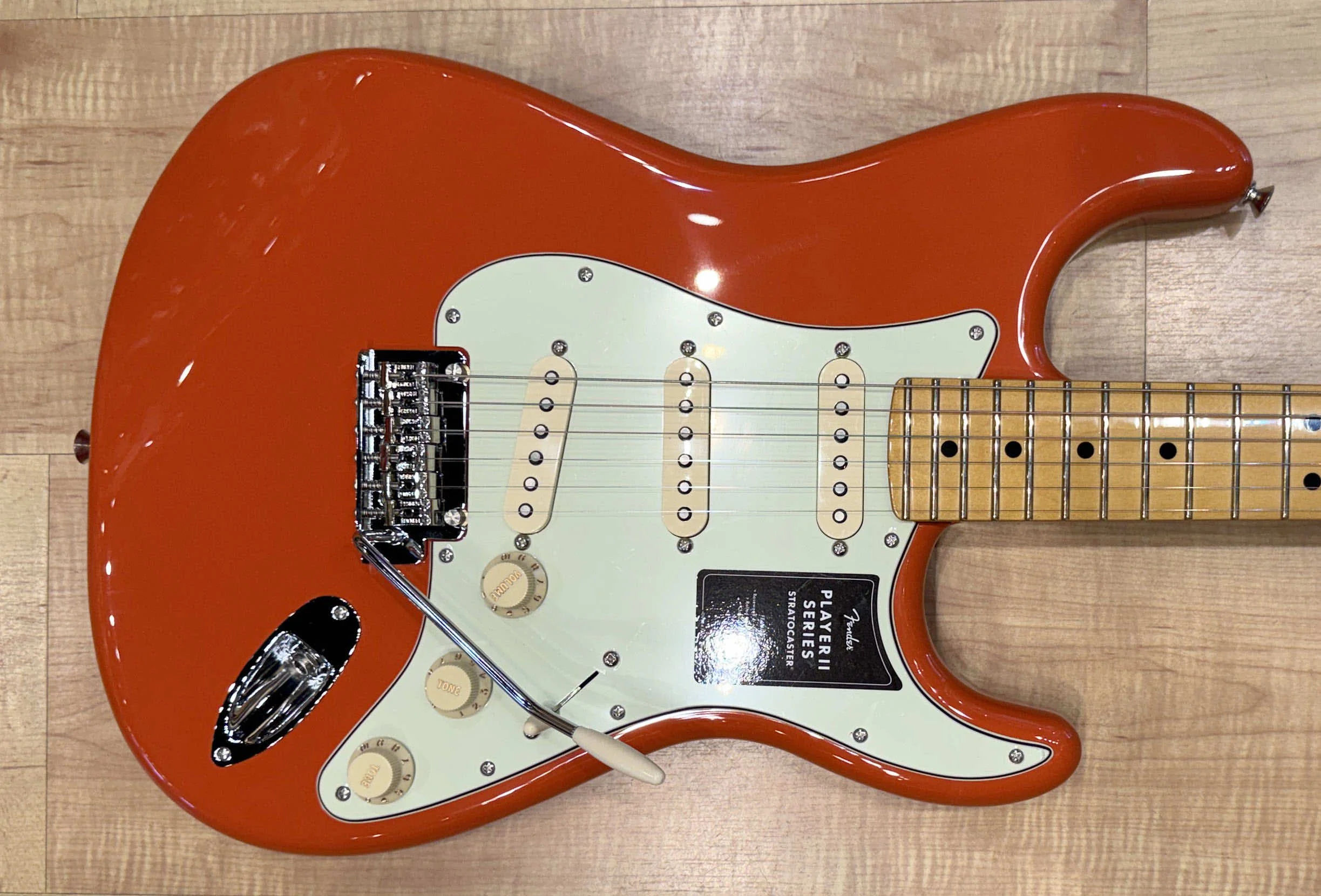 Pickguard of the Fender Player II Stratocaster Electric Guitar In Rallye Orange