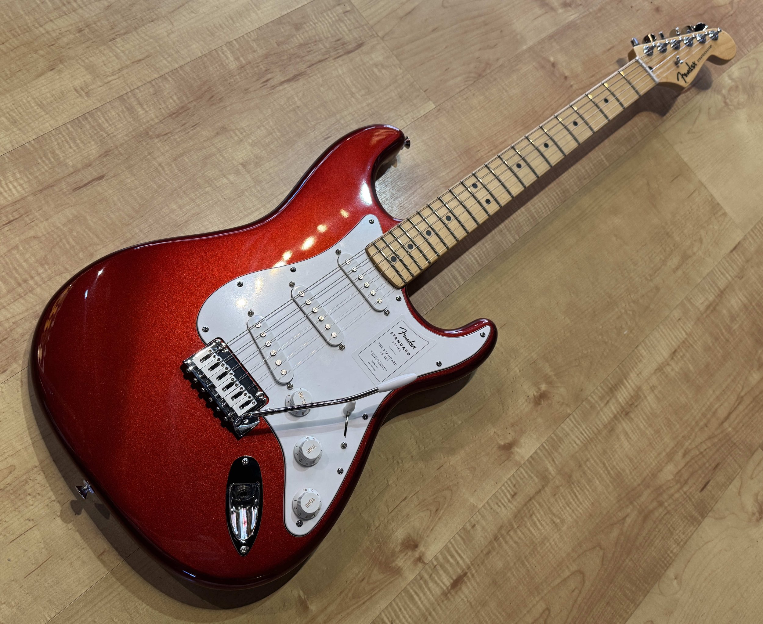 Neck of the Fender Standard Stratocaster Electric Guitar In Candy Cola