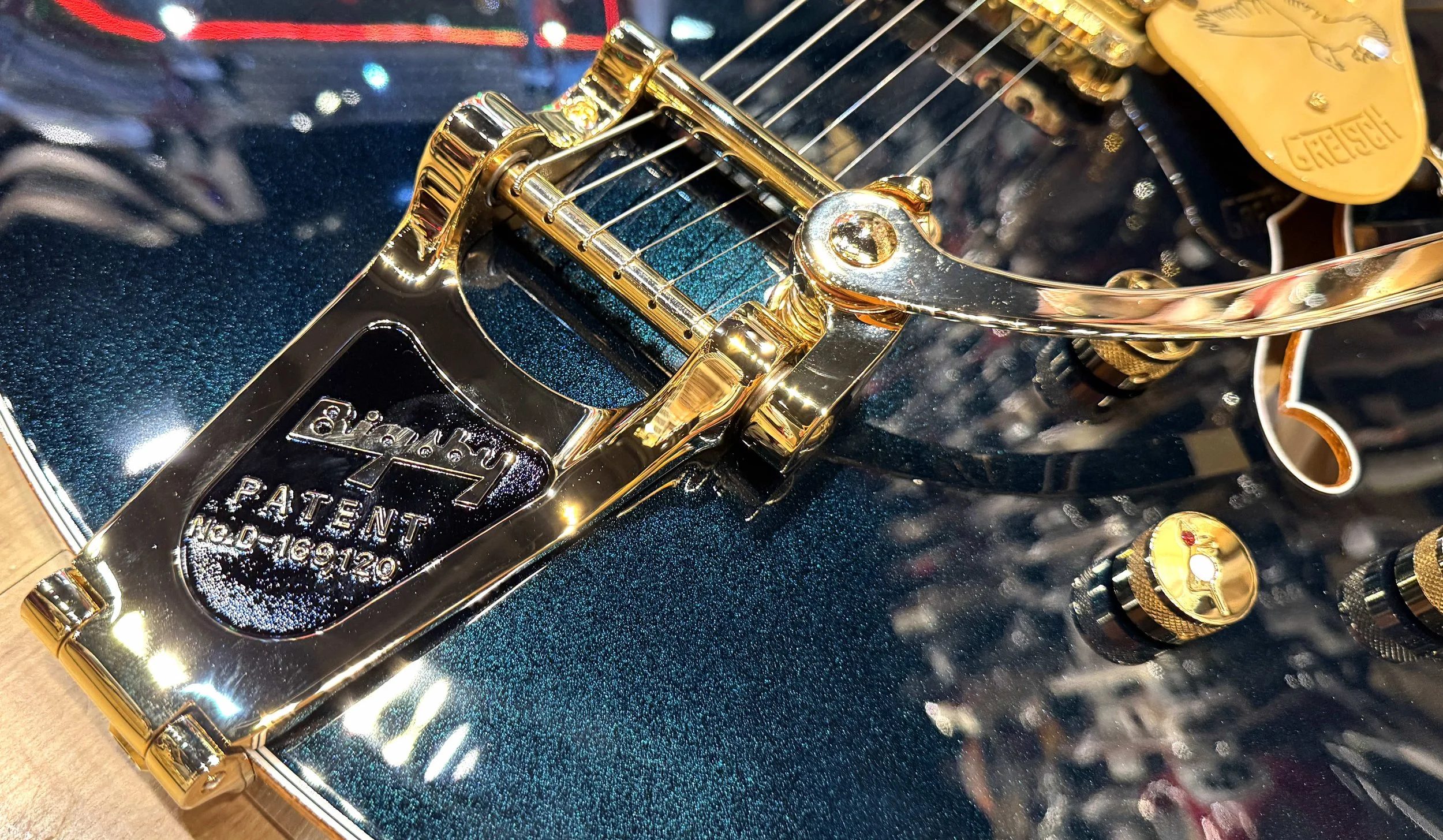 Tailpiece of the Gretsch Falcon Center Block LImited Edition with String-Thru Bigsby and Gold Hardware Electric Guitar In Midnight Sapphire Serial Number JT25093014