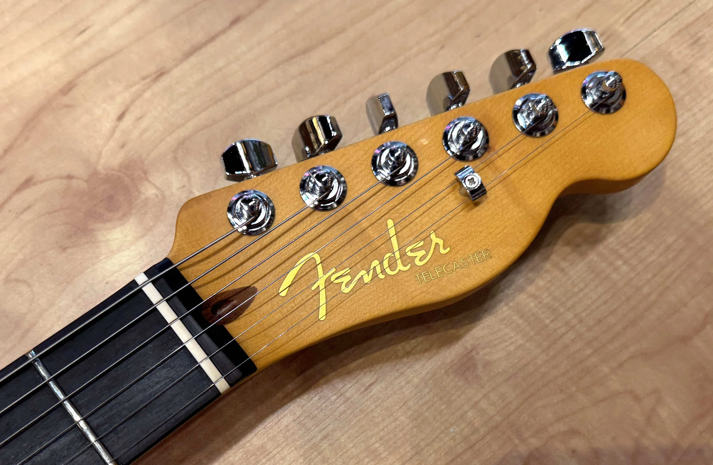 Headstock of the Fender American Ultra II Telecaster Electric Guitar In Texas Tea