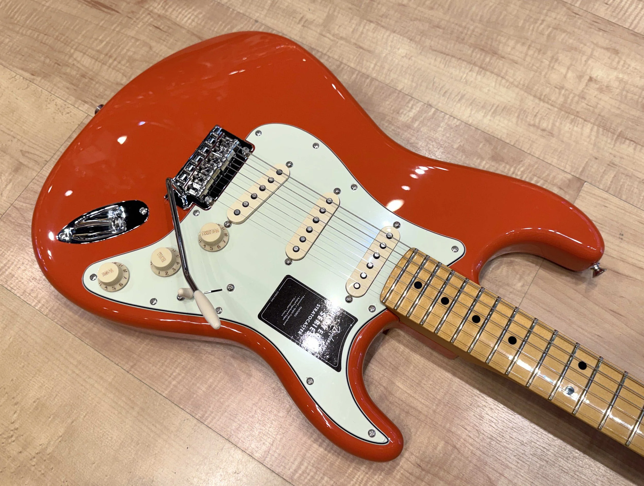 Pickguard of the Fender Player II Stratocaster Electric Guitar In Rallye Orange