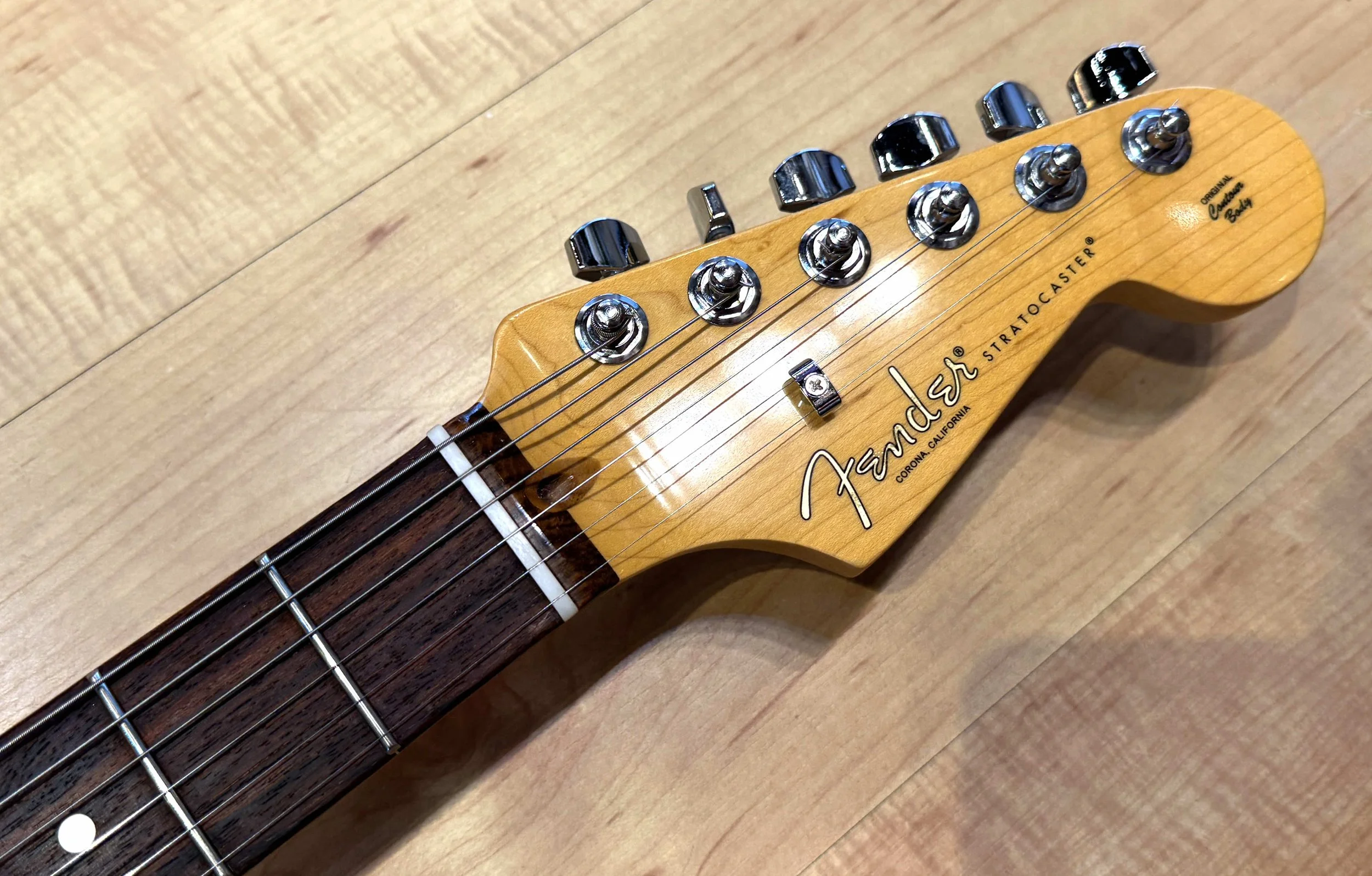 Headstock of the Fender American Professional II Stratocaster Electric Guitar In Dark Night